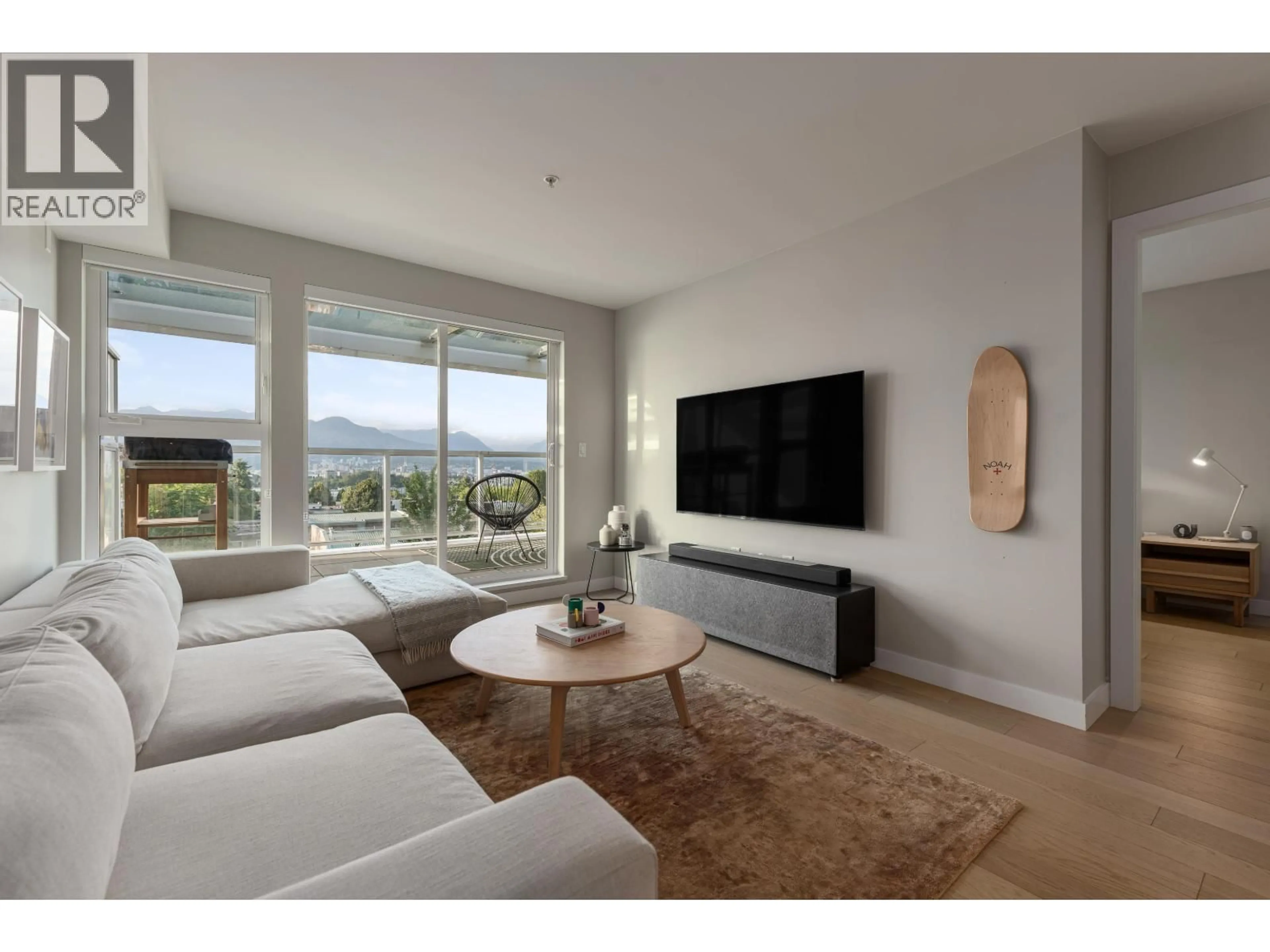 Living room with furniture, unknown for 406 - 2508 FRASER STREET, Vancouver British Columbia V5T3V4