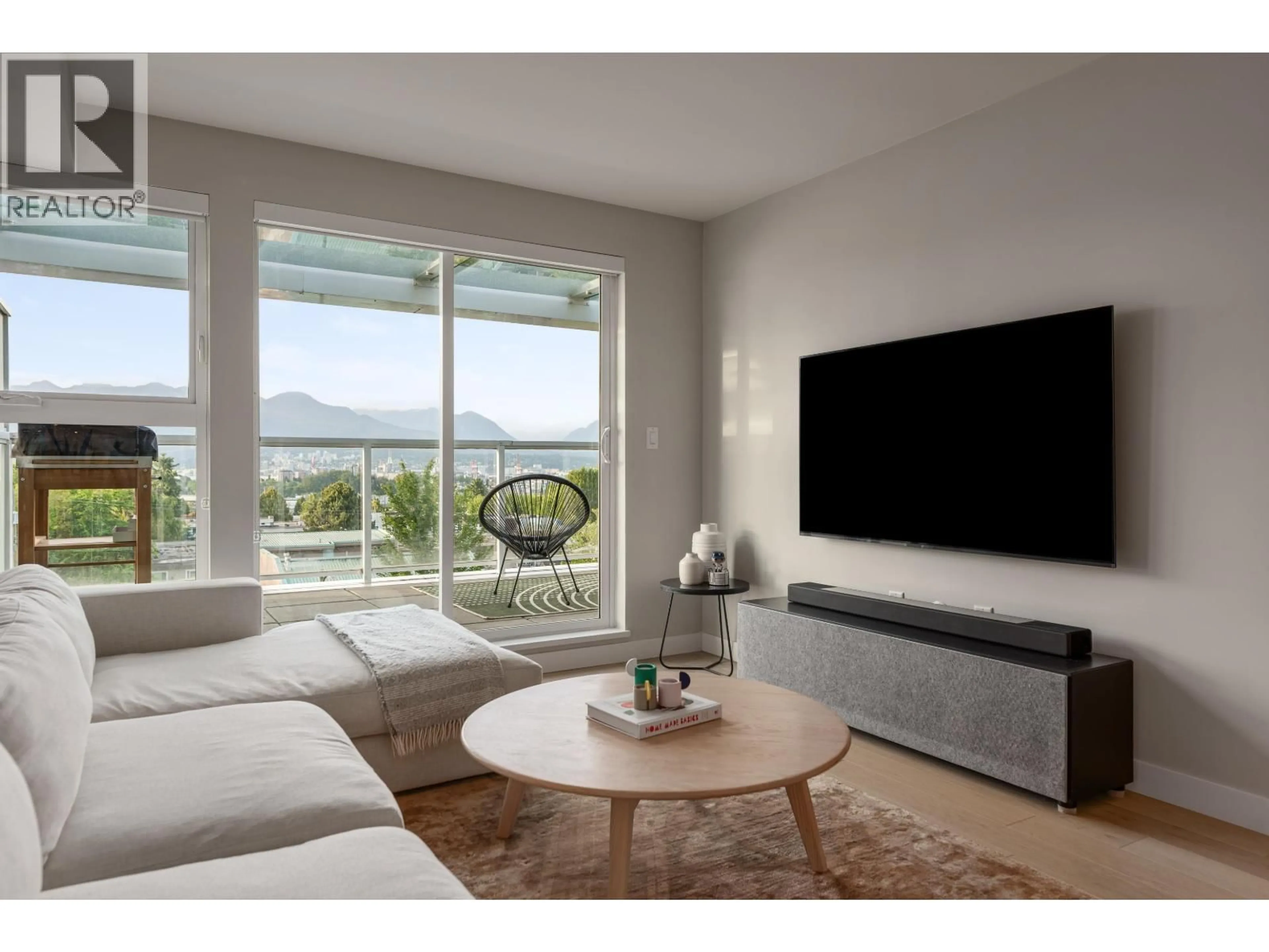 Living room with furniture, unknown for 406 - 2508 FRASER STREET, Vancouver British Columbia V5T3V4