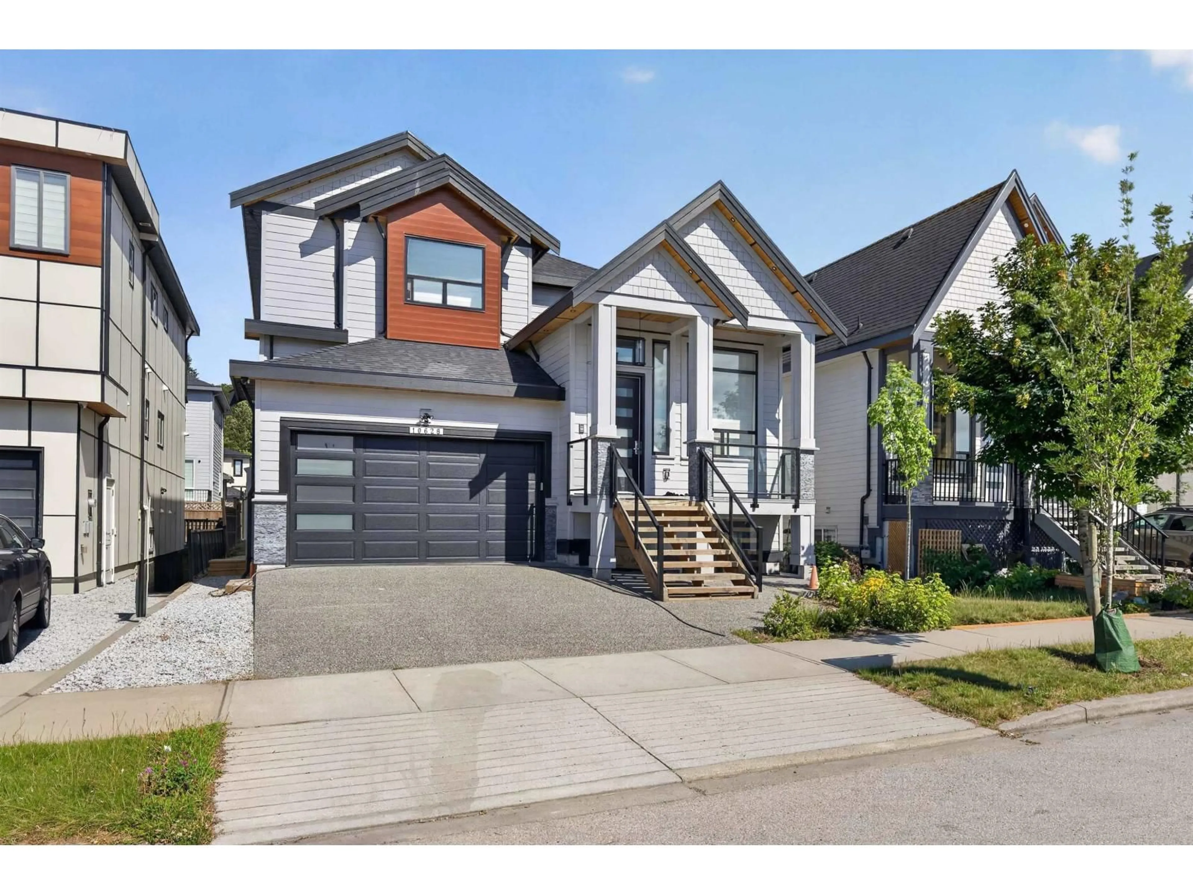 Home with vinyl exterior material, street for 10628 124 STREET, Surrey British Columbia V3V0E2