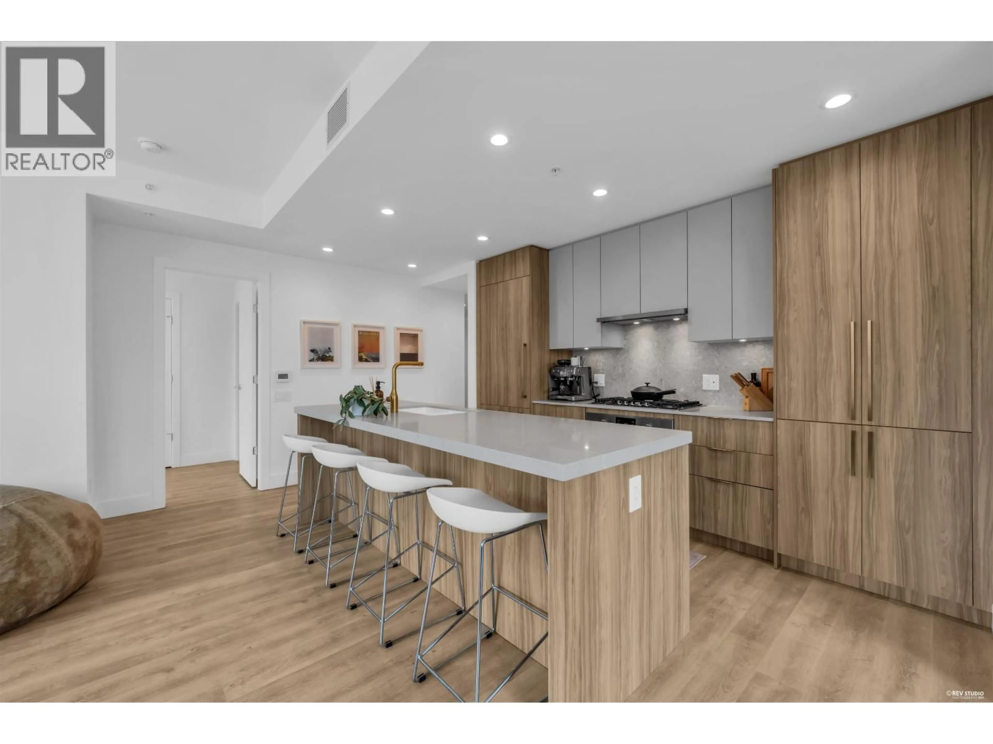 Open concept kitchen, wood/laminate floor for 306 - 2325 EMERY COURT, North Vancouver British Columbia V7J0E8