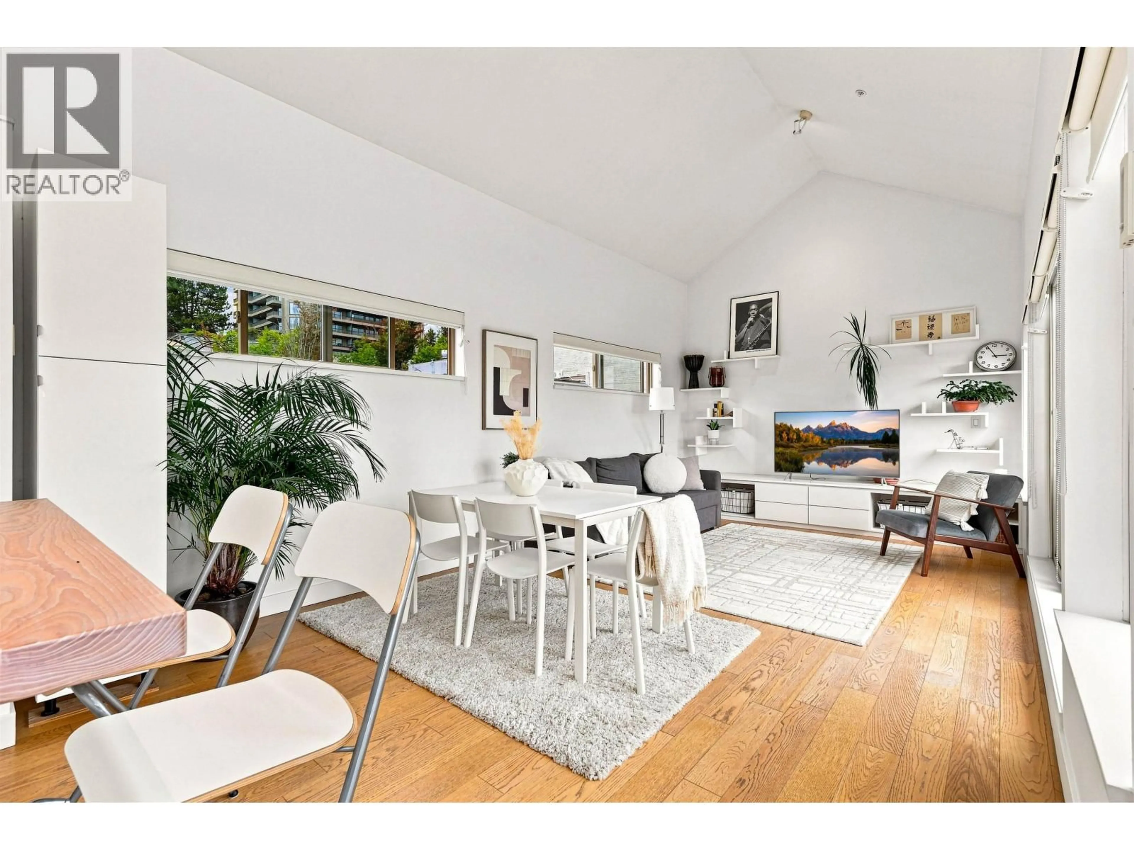 Living room with furniture, wood/laminate floor for 19 - 3737 PENDER STREET, Burnaby British Columbia V5C2L2