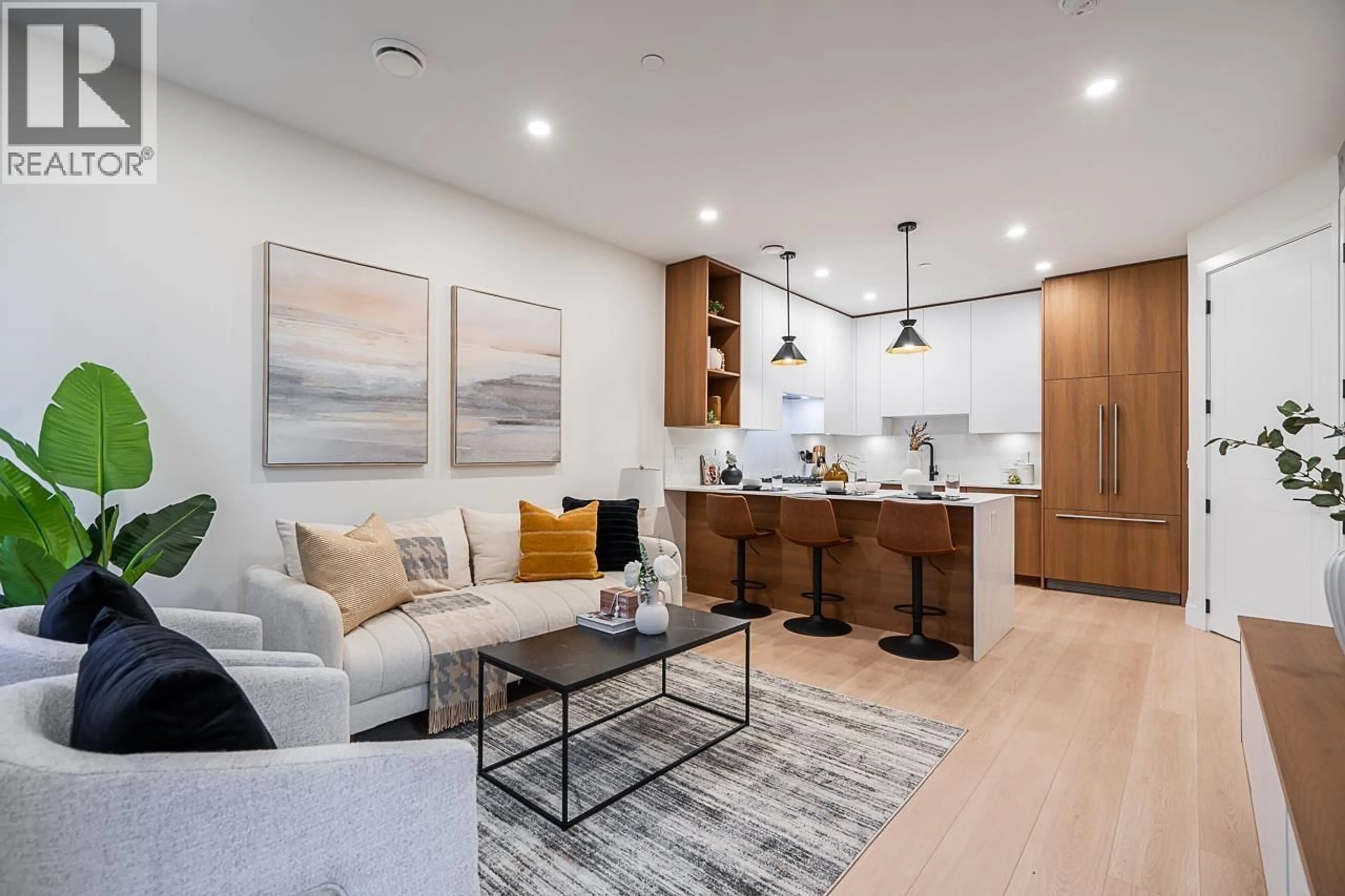 Living room with furniture, wood/laminate floor for 2 - 3638 NORMANDY DRIVE, Vancouver British Columbia V5M2G3