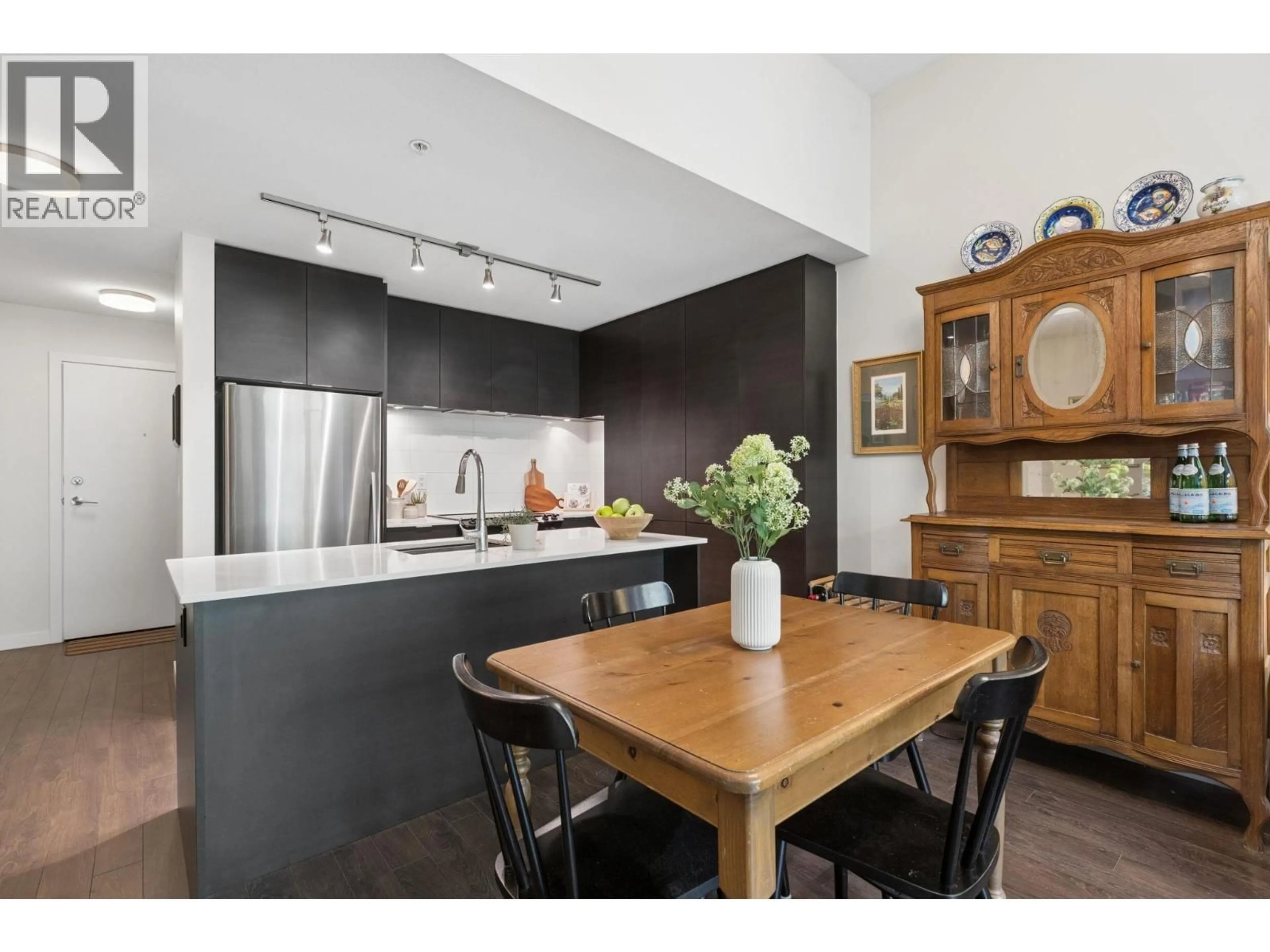 Open concept kitchen, wood/laminate floor for 506 - 1679 LLOYD AVENUE, North Vancouver British Columbia V7P0A9