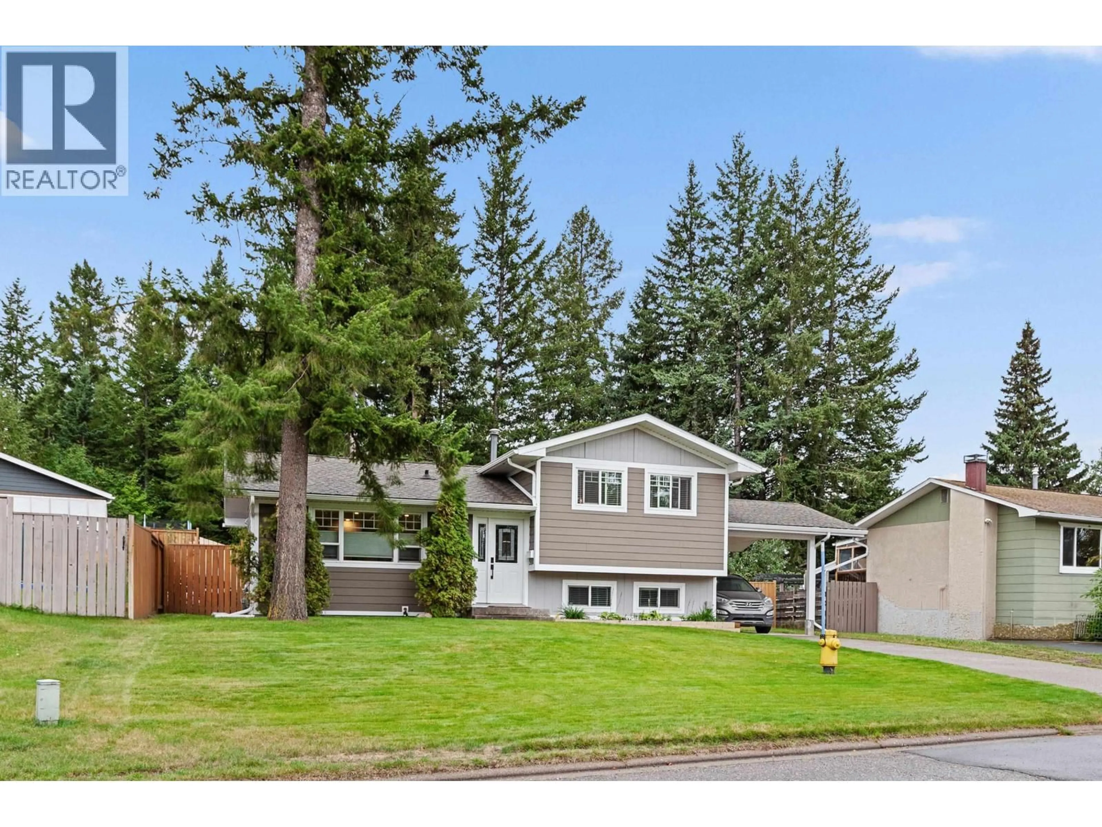 Home with vinyl exterior material, street for 7511 JEAN DE BREBEUF CRESCENT, Prince George British Columbia V2N3A8