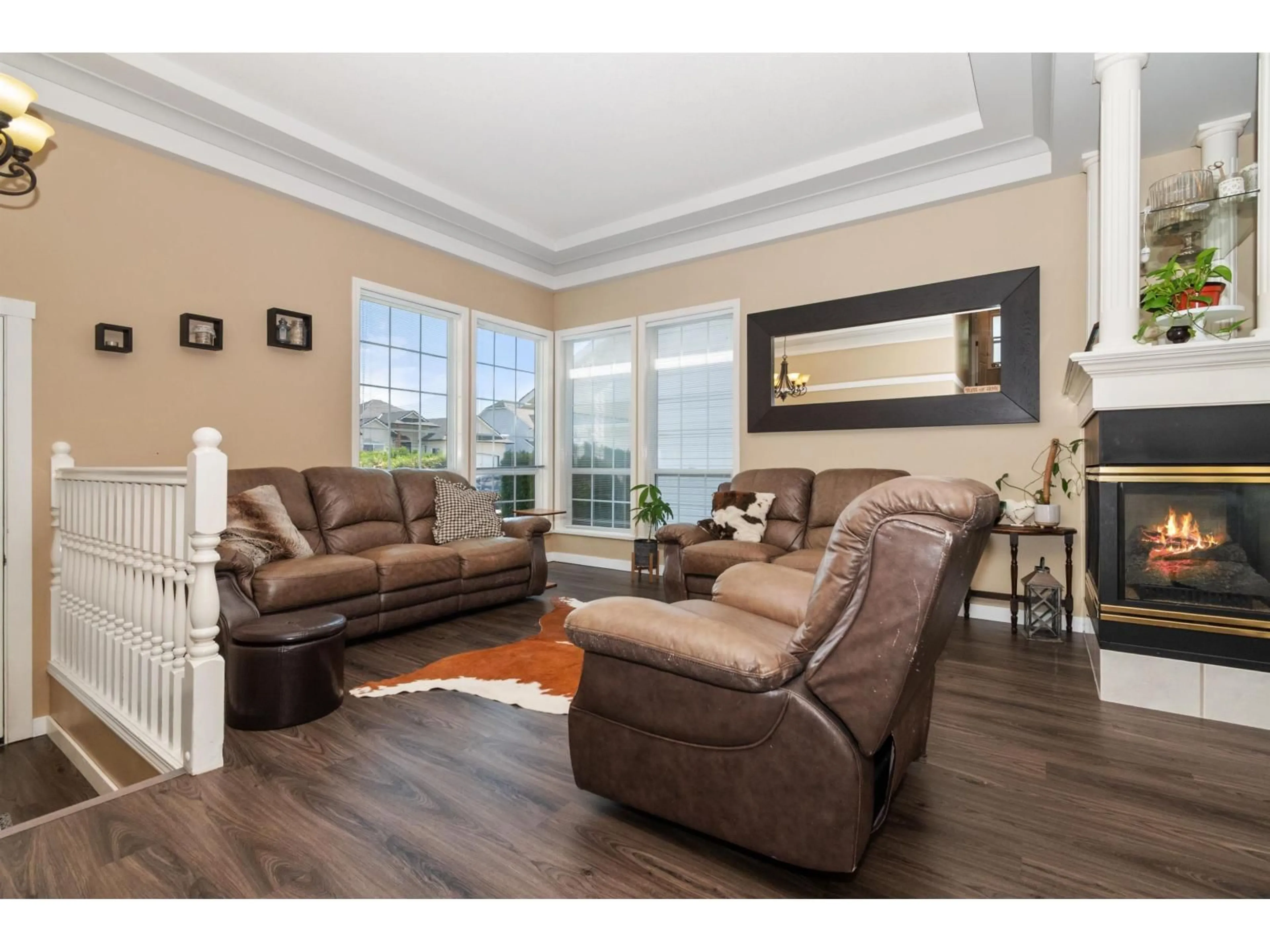Living room with furniture, wood/laminate floor for 5683 MONTESINA PLACE, Chilliwack British Columbia V2R3N8