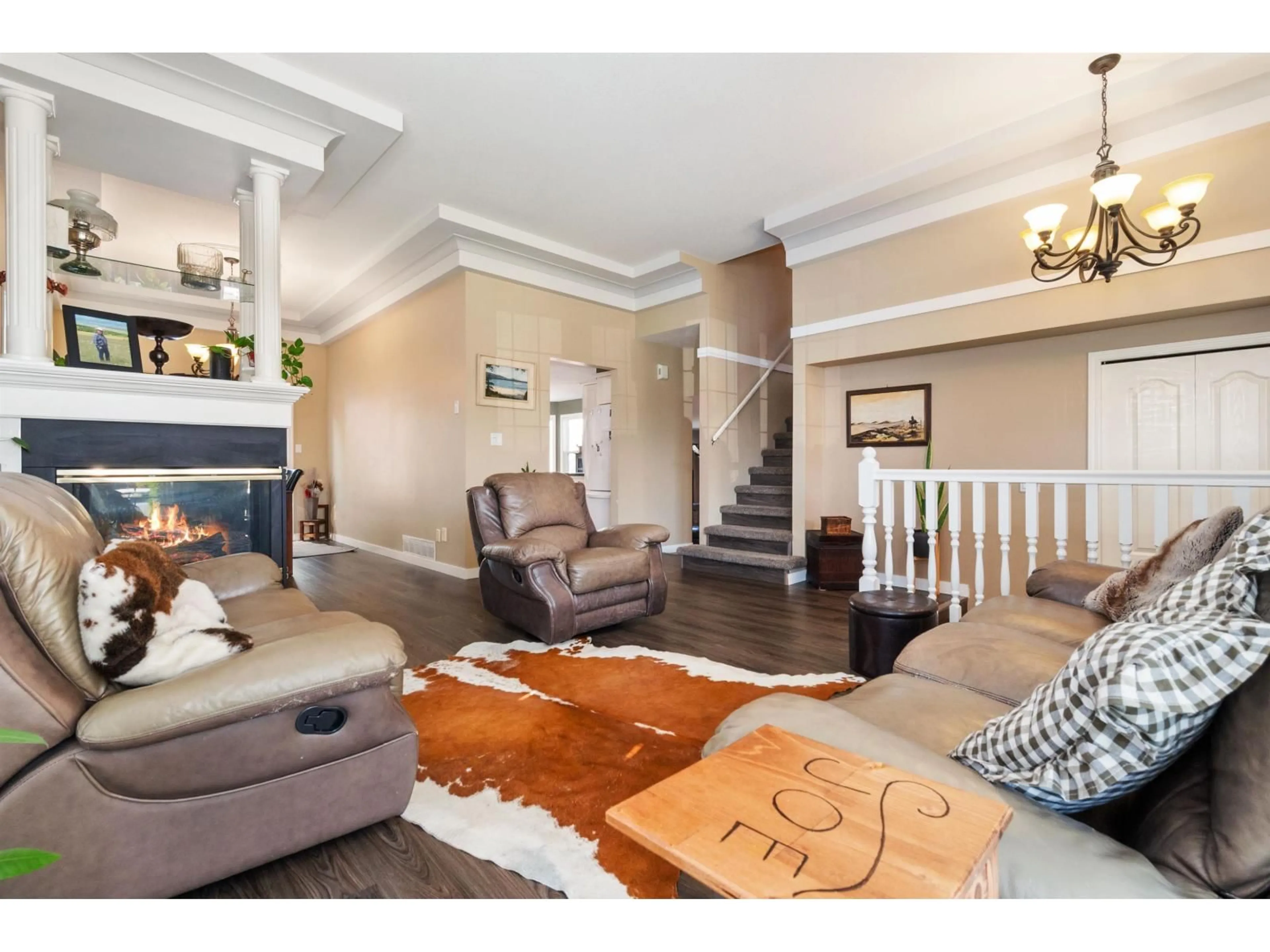 Living room with furniture, wood/laminate floor for 5683 MONTESINA PLACE, Chilliwack British Columbia V2R3N8