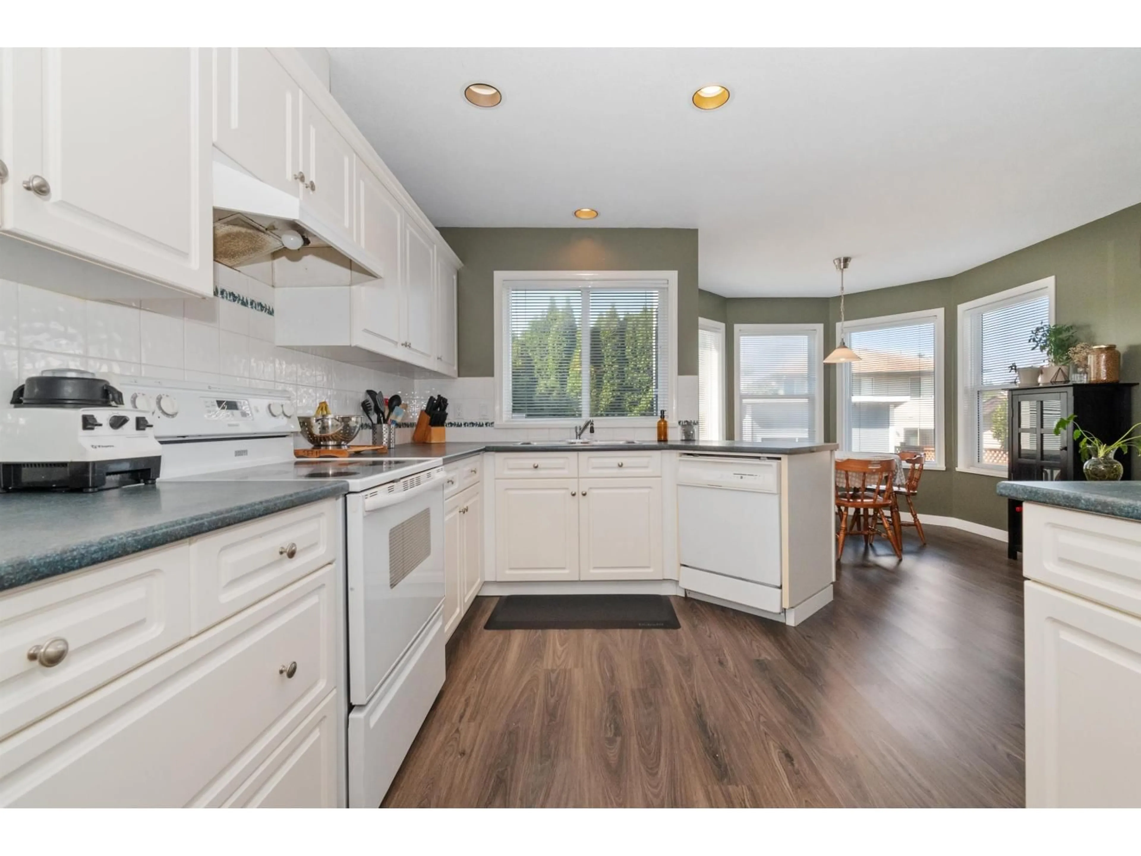 Open concept kitchen, wood/laminate floor for 5683 MONTESINA PLACE, Chilliwack British Columbia V2R3N8