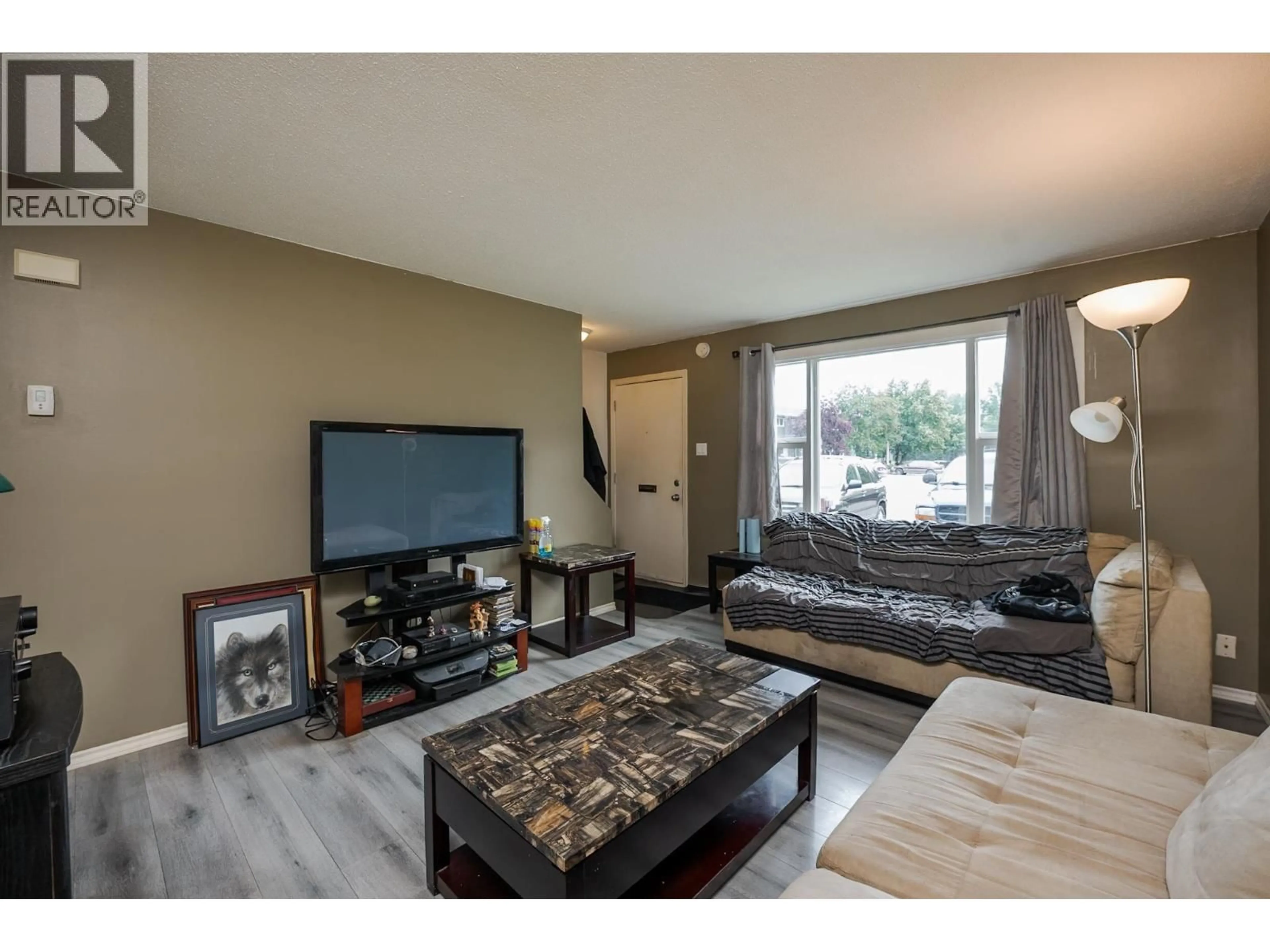 Living room with furniture, wood/laminate floor for F56 - 1900 STRATHCONA AVENUE, Prince George British Columbia V2L2V9