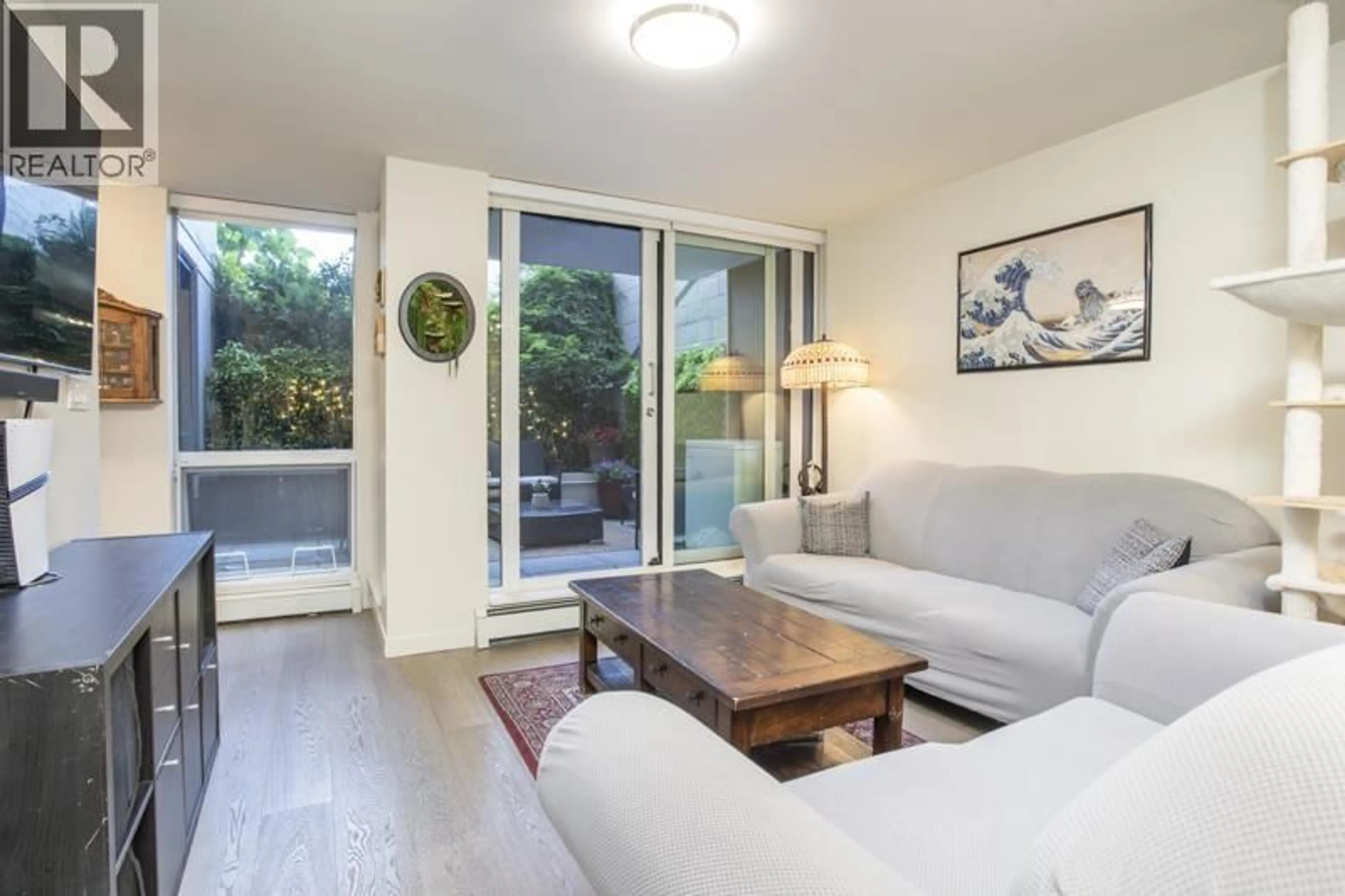 Living room with furniture, wood/laminate floor for 208 - 189 KEEFER STREET, Vancouver British Columbia V6A0C8