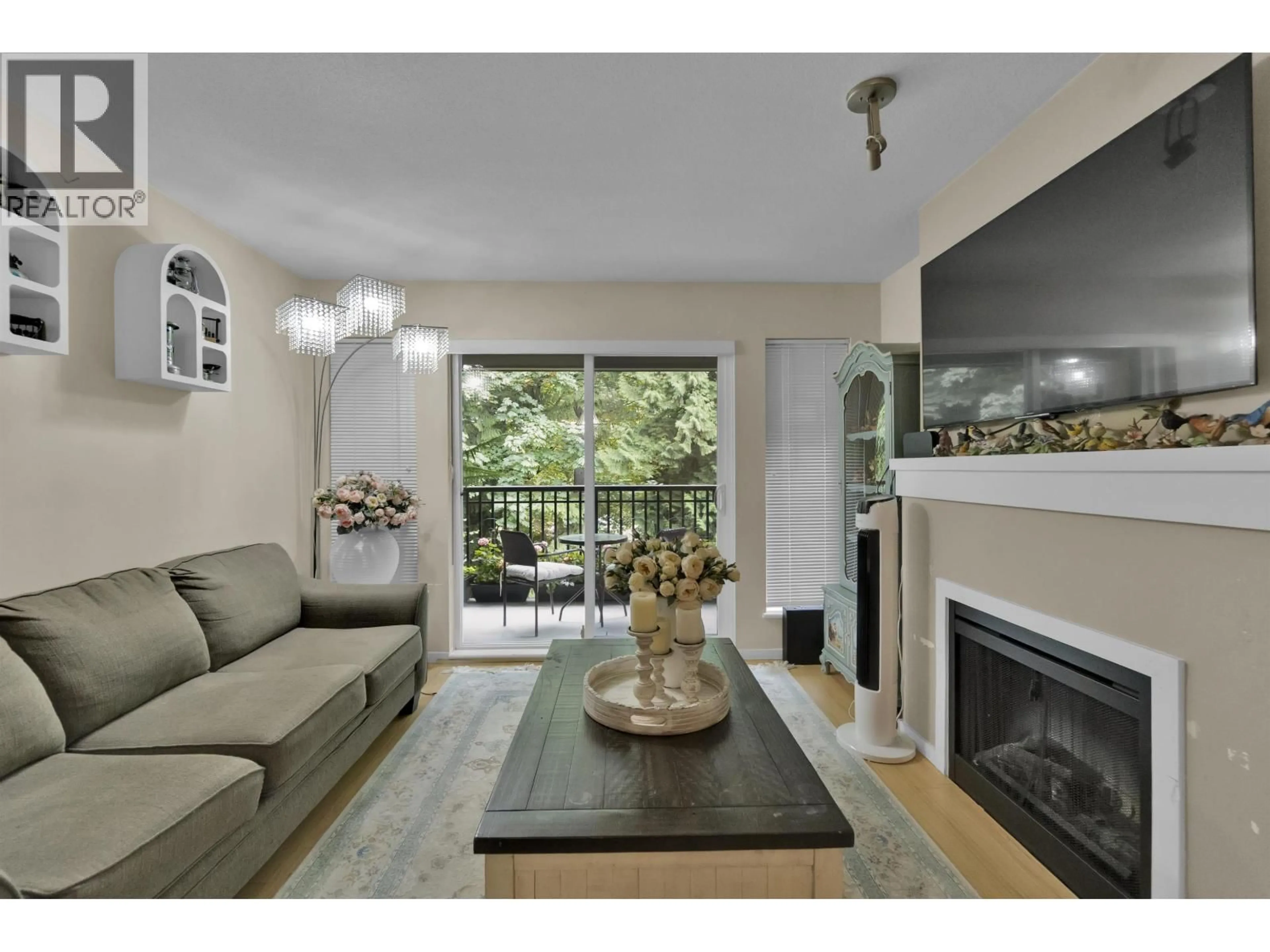 Living room with furniture, wood/laminate floor for 306 - 9283 GOVERNMENT ROAD, Burnaby British Columbia V3N0A5