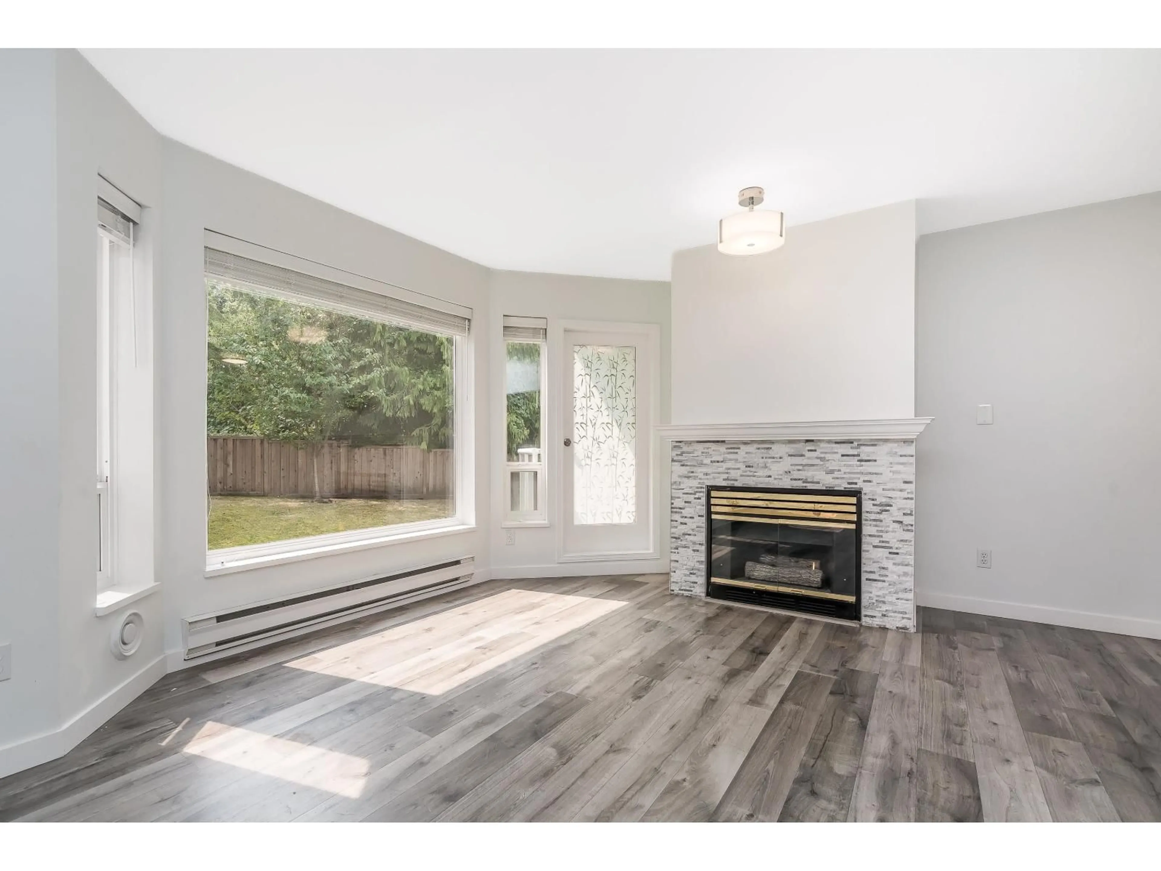 Living room with furniture, wood/laminate floor for 203 - 2855 152 STREET, Surrey British Columbia V4P1H2
