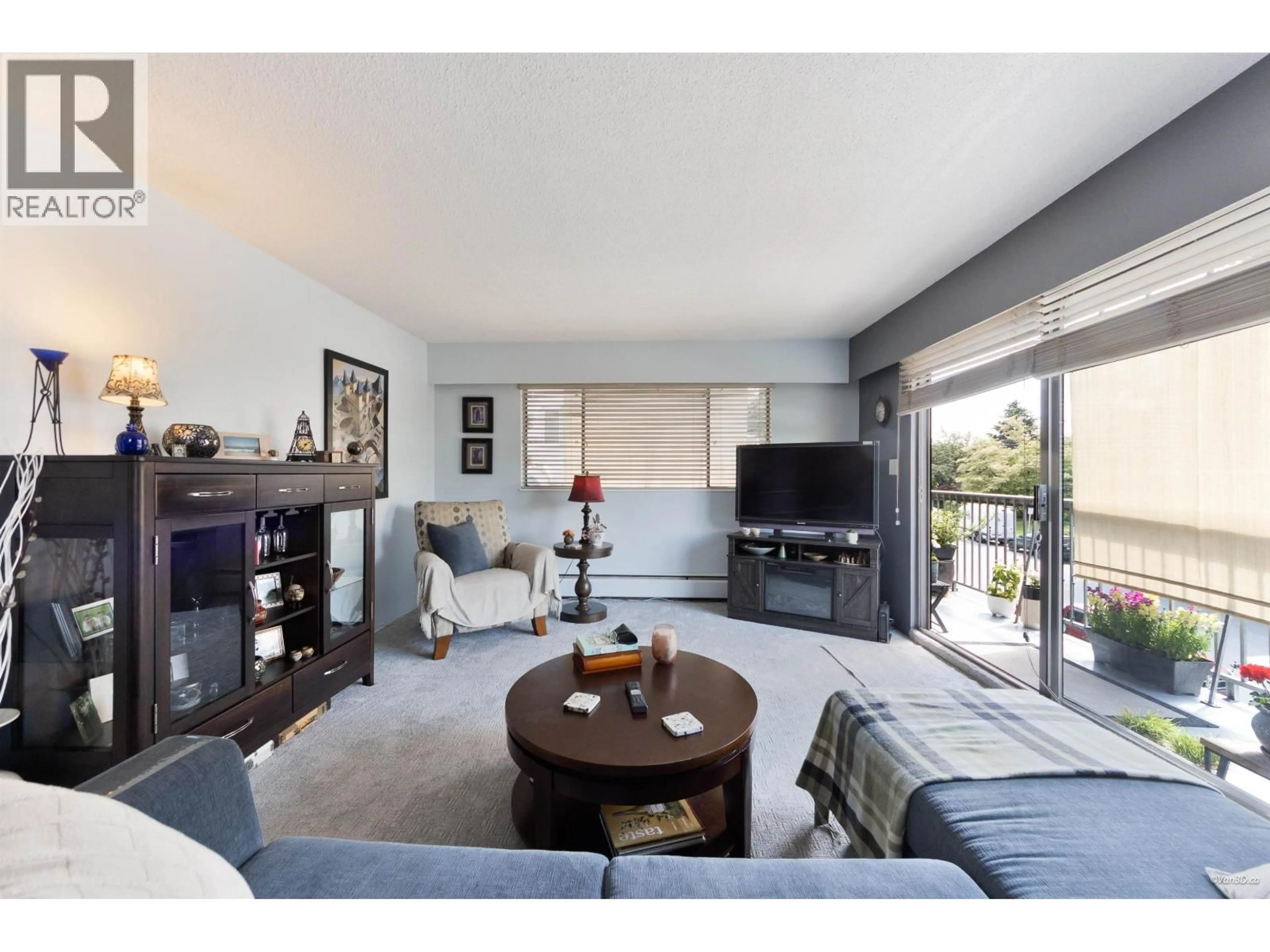 Living room with furniture, wood/laminate floor for 205 - 330 2ND STREET, North Vancouver British Columbia V7M1E1