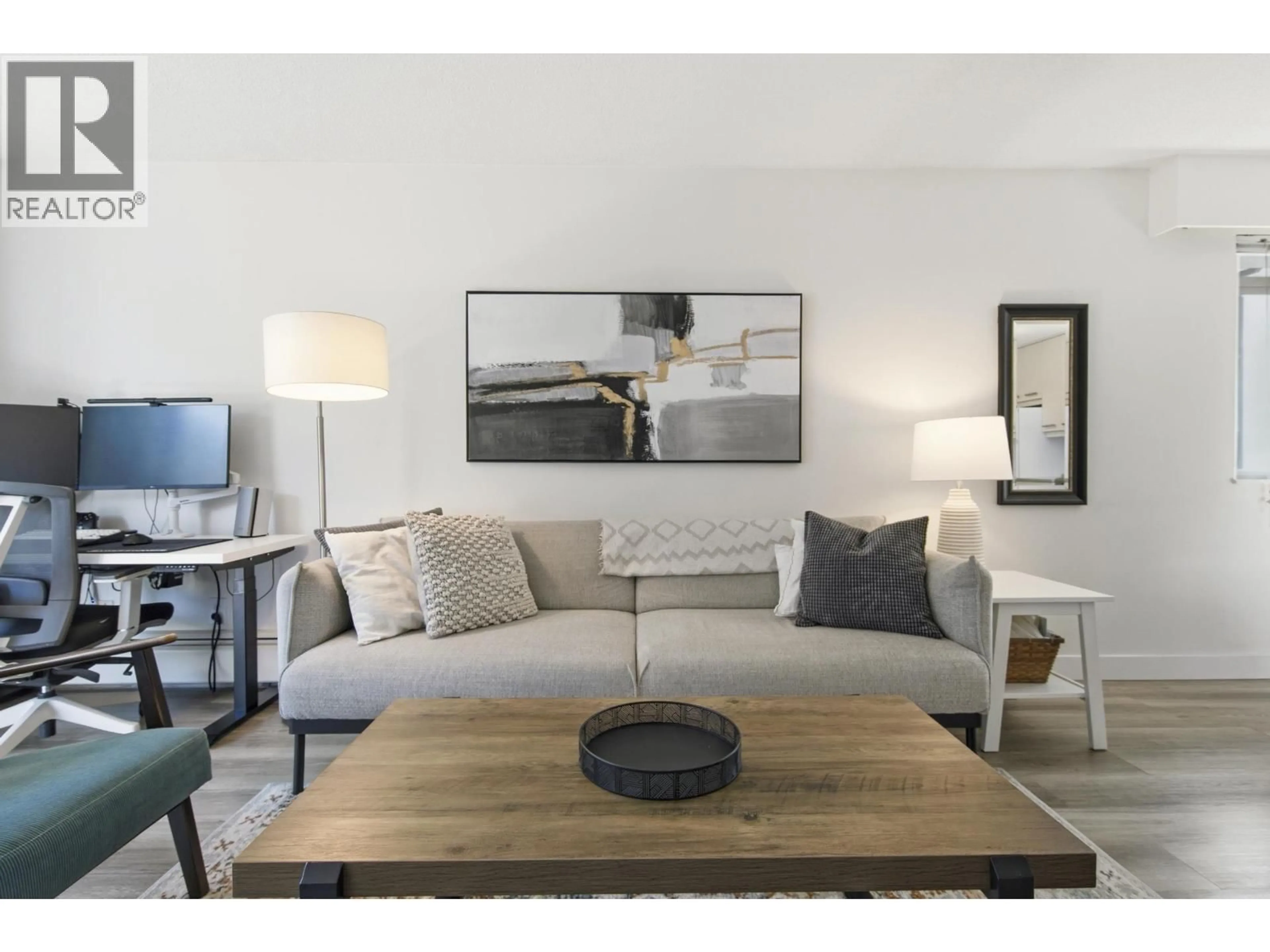 Living room with furniture, wood/laminate floor for 203 - 270 3RD STREET, North Vancouver British Columbia V7M1G1