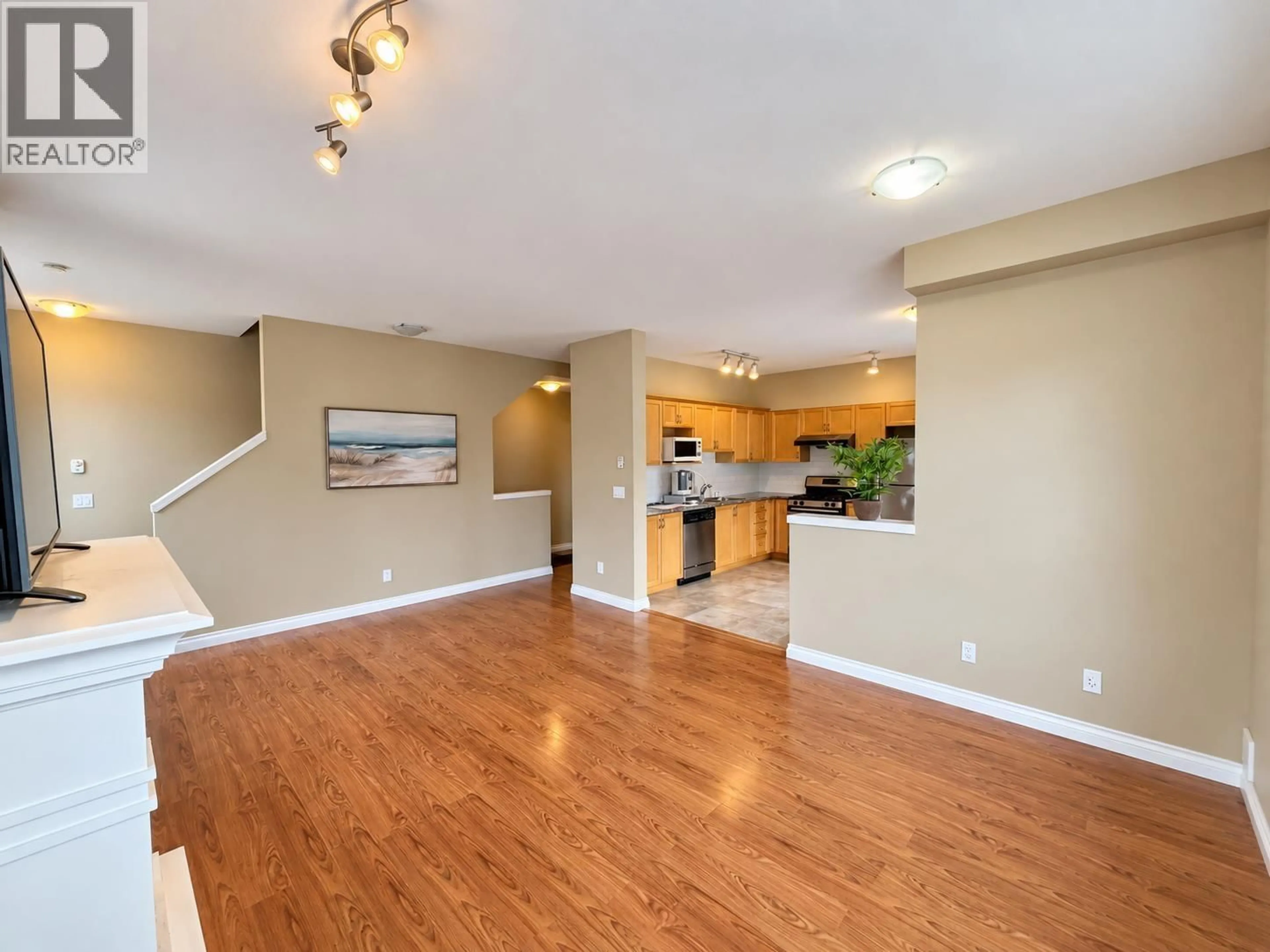 Open concept kitchen, wood/laminate floor for 26 - 11511 STEVESTON HIGHWAY, Richmond British Columbia V7A1N8