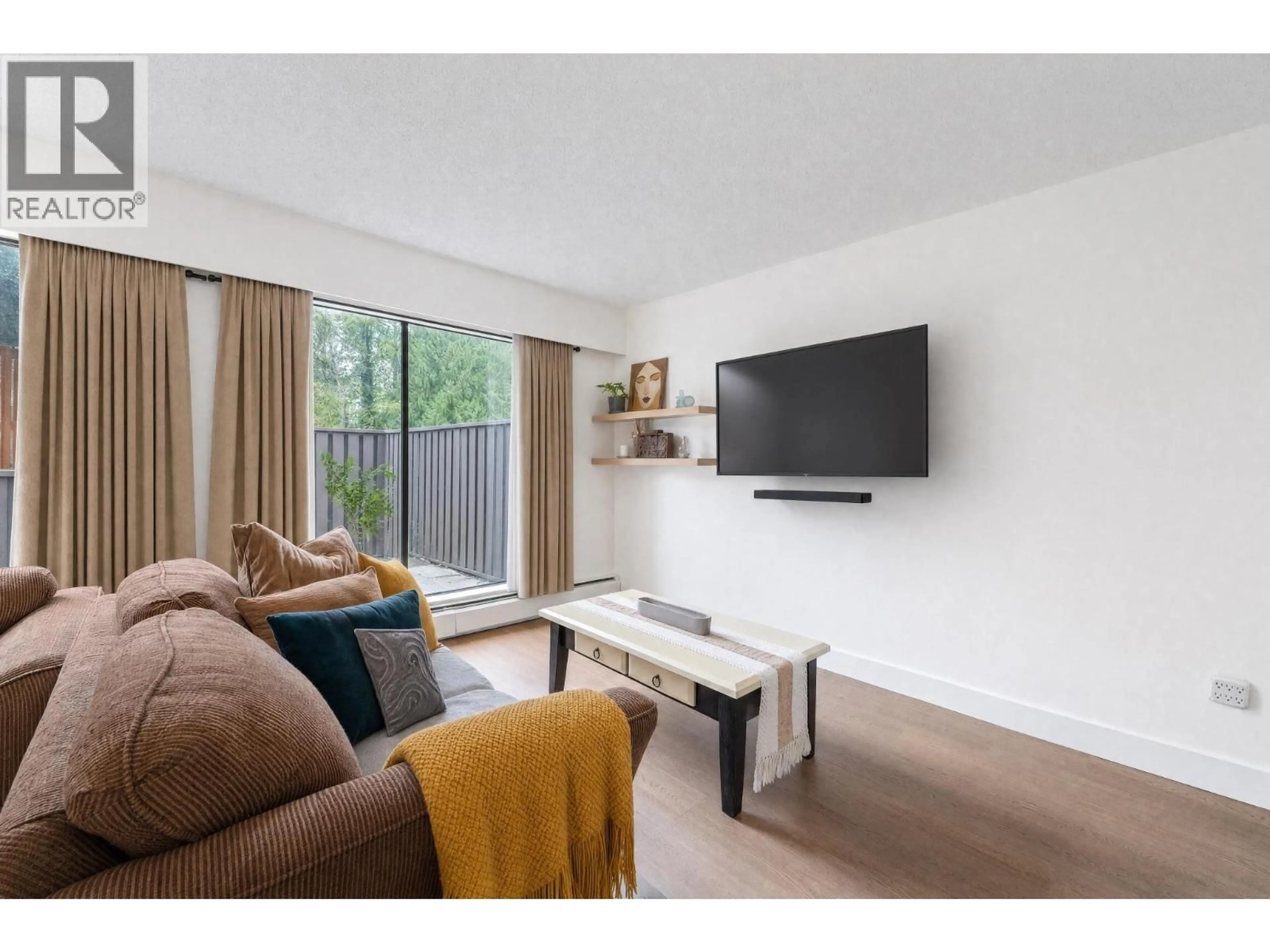 Living room with furniture, wood/laminate floor for 8865 HORNE STREET, Burnaby British Columbia V3N4J8