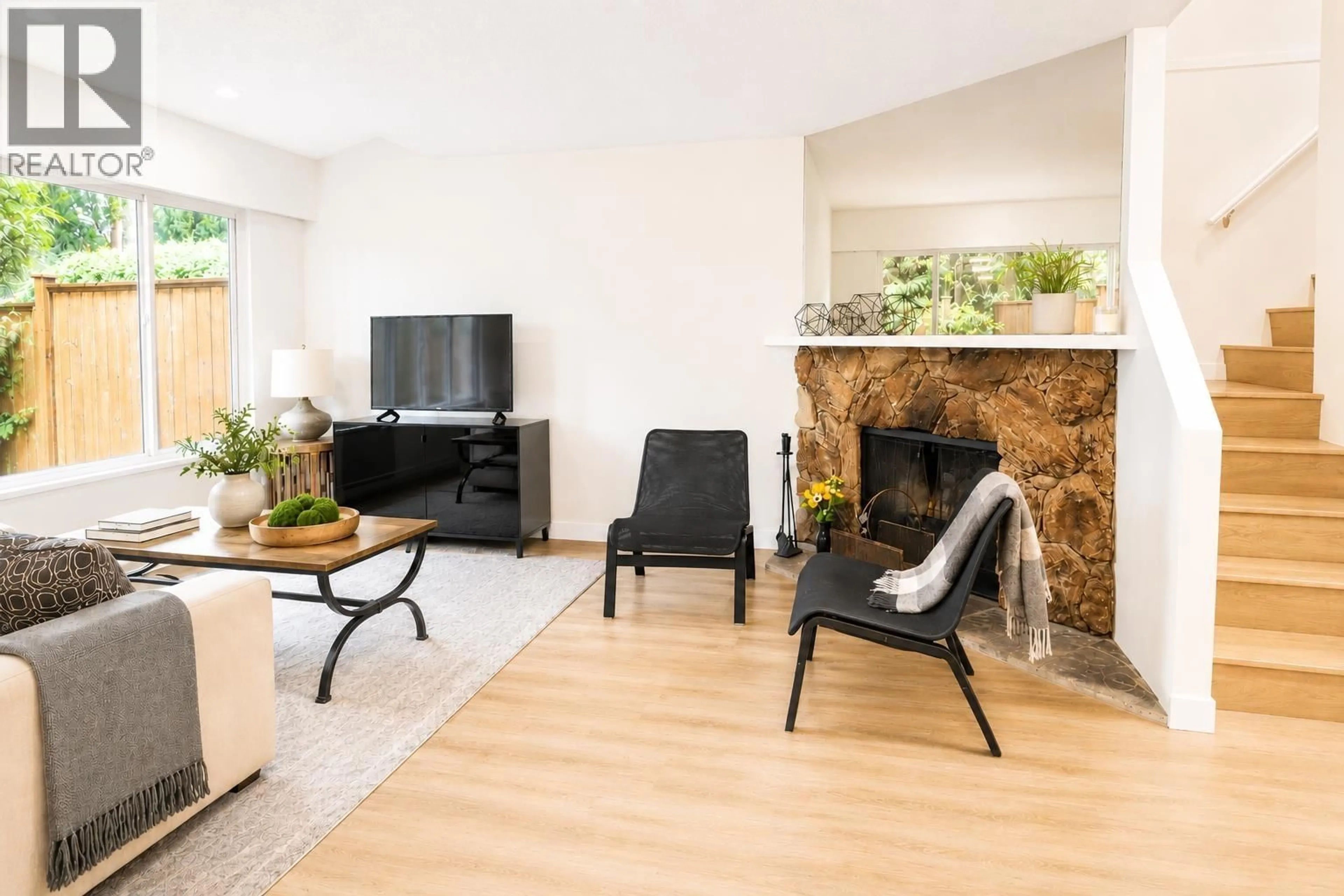 Living room with furniture, wood/laminate floor for 20 - 7300 LEDWAY ROAD, Richmond British Columbia V7C4N9