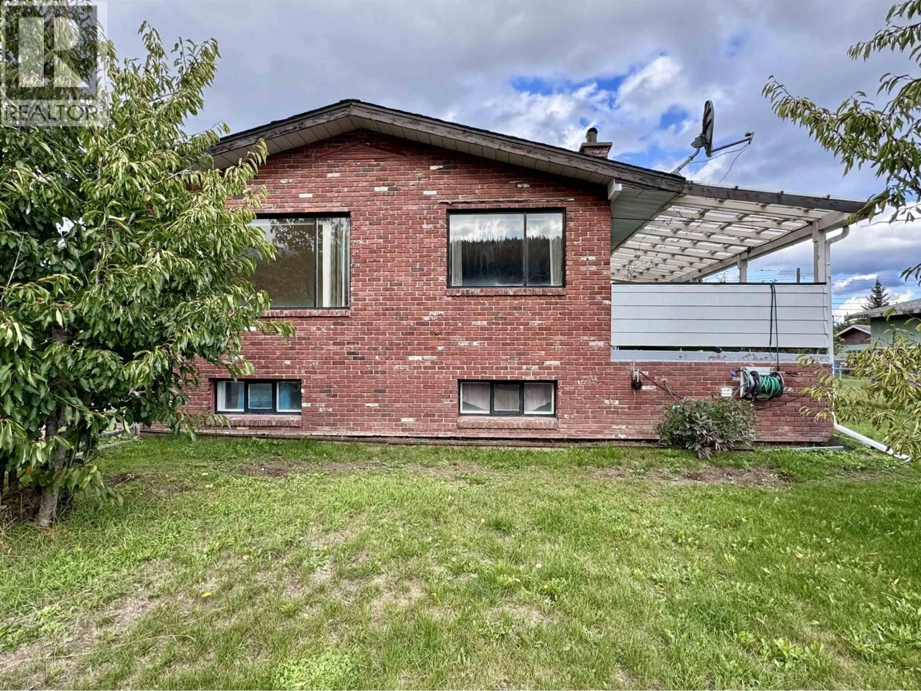 Home with brick exterior material, street for 4020 FIRST AVENUE, Smithers British Columbia V0J2N0