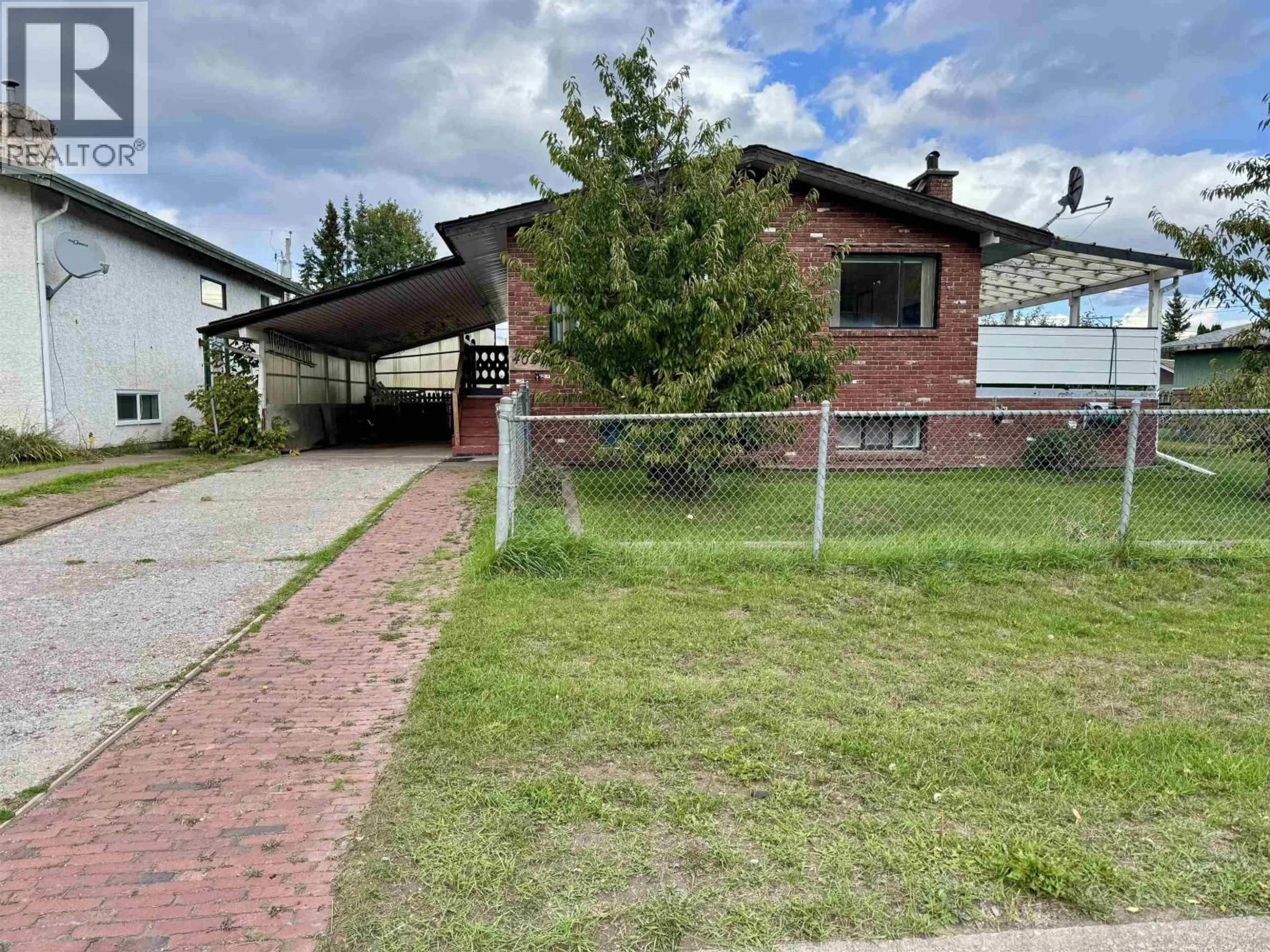 Home with brick exterior material, street for 4020 FIRST AVENUE, Smithers British Columbia V0J2N0