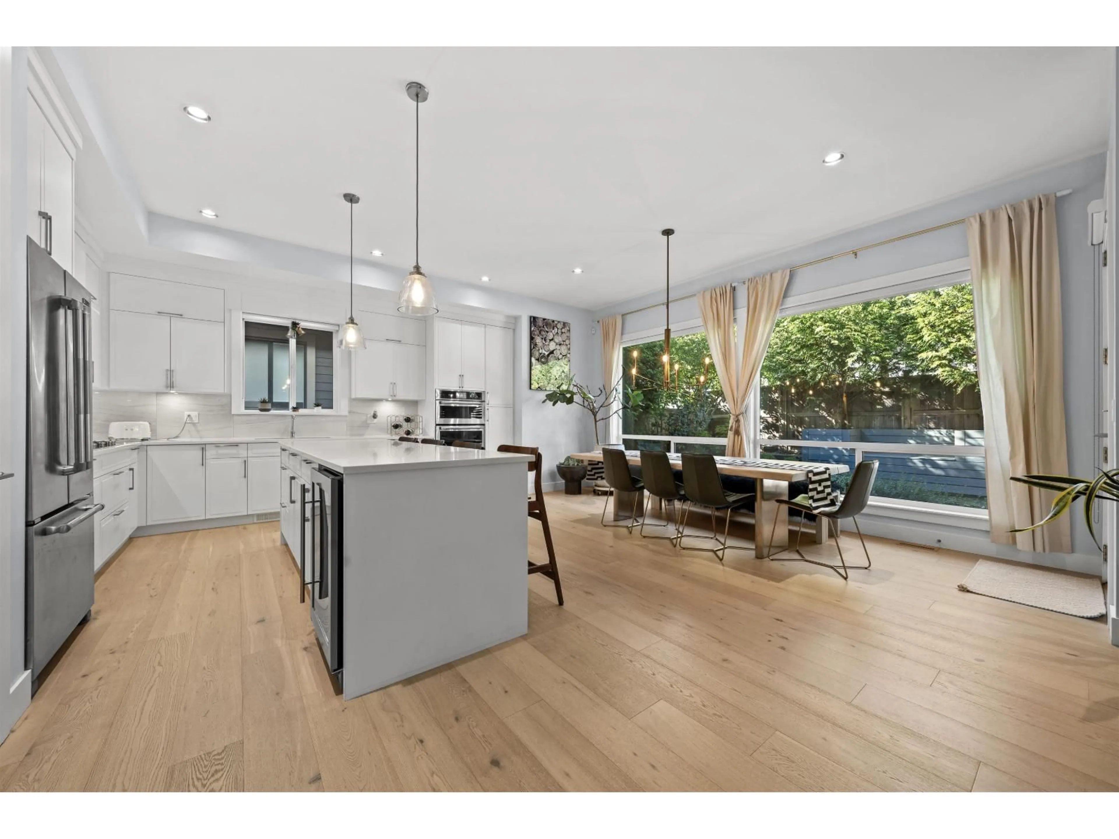 Open concept kitchen, wood/laminate floor for 16735 17A AVENUE, Surrey British Columbia V3Z0T3