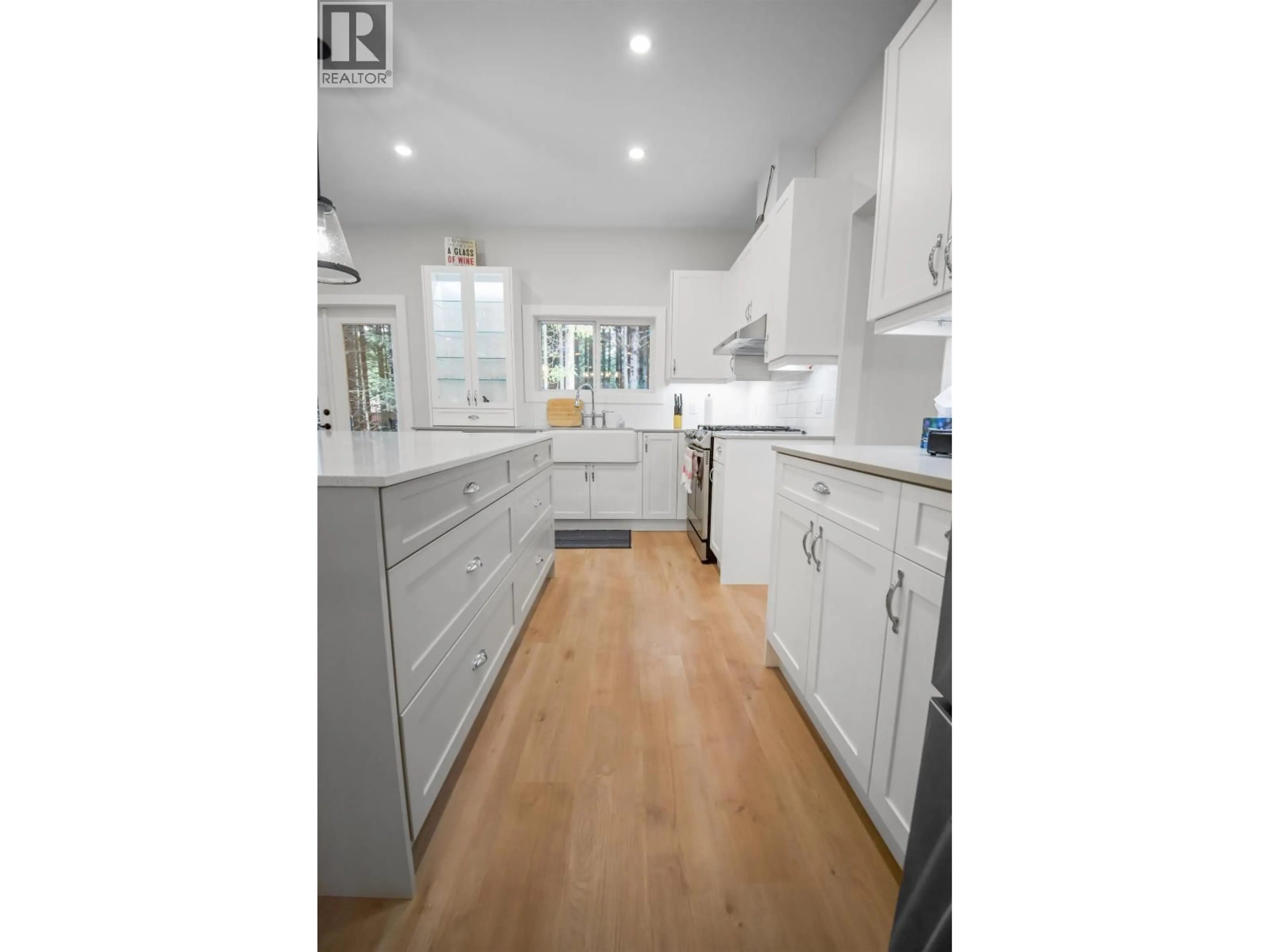 Open concept kitchen, wood/laminate floor for 51 ELDERBERRY STREET, Kitimat British Columbia V8C0A9