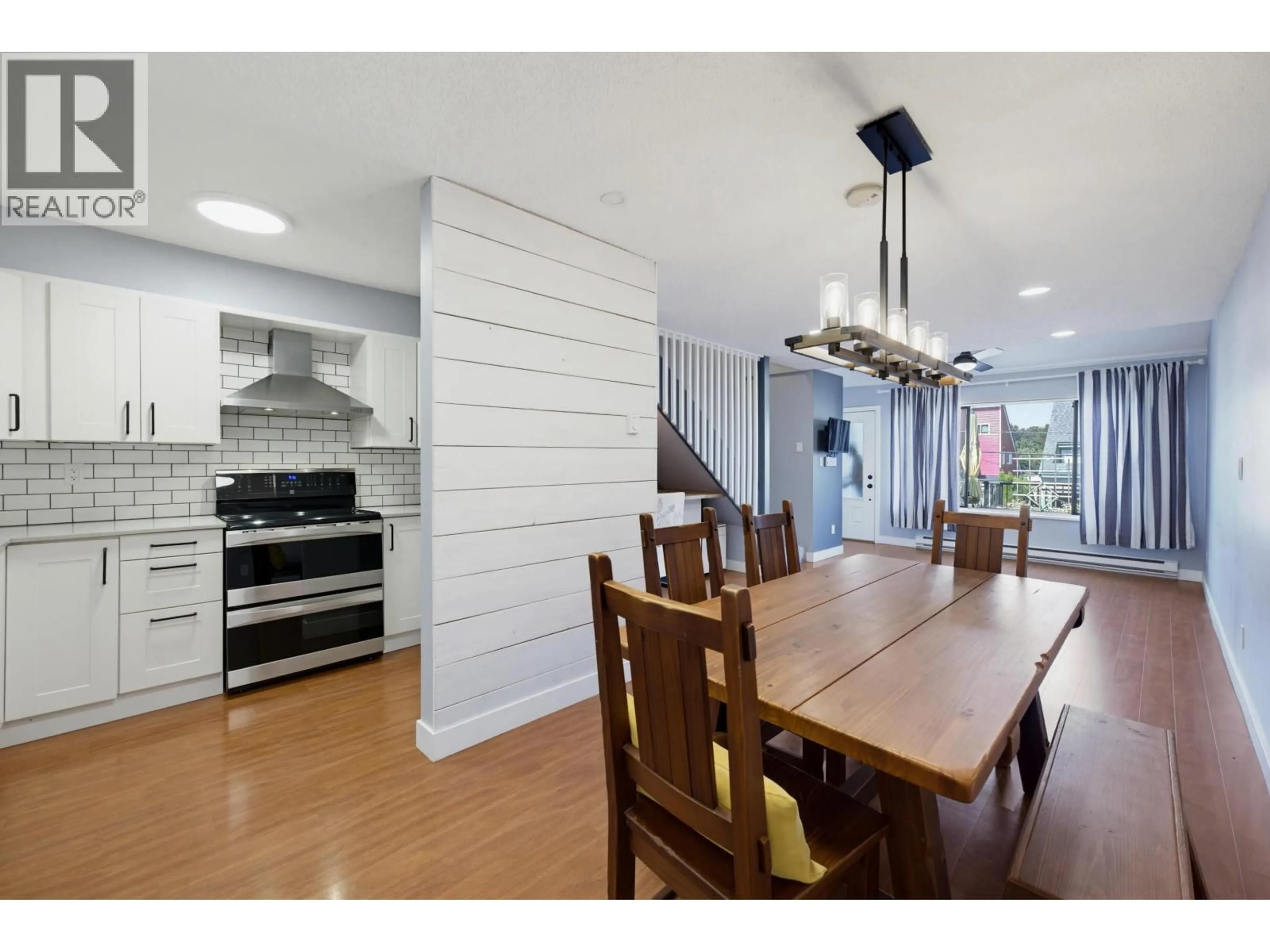 Open concept kitchen, wood/laminate floor for 4716 48B STREET, Ladner British Columbia V4K2S2