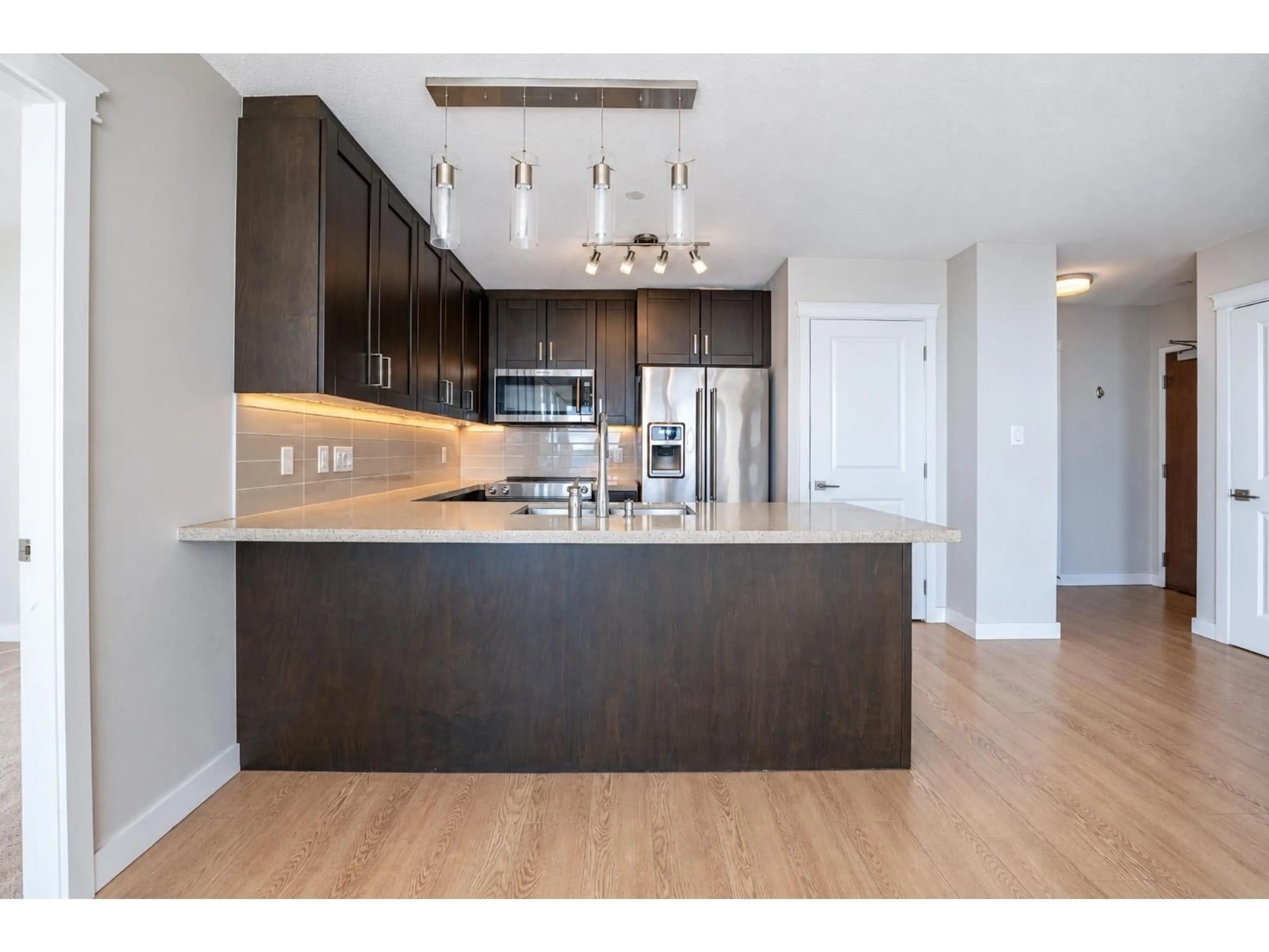 Open concept kitchen, wood/laminate floor for 3608 - 11967 80 AVENUE, Delta British Columbia V4C0E2