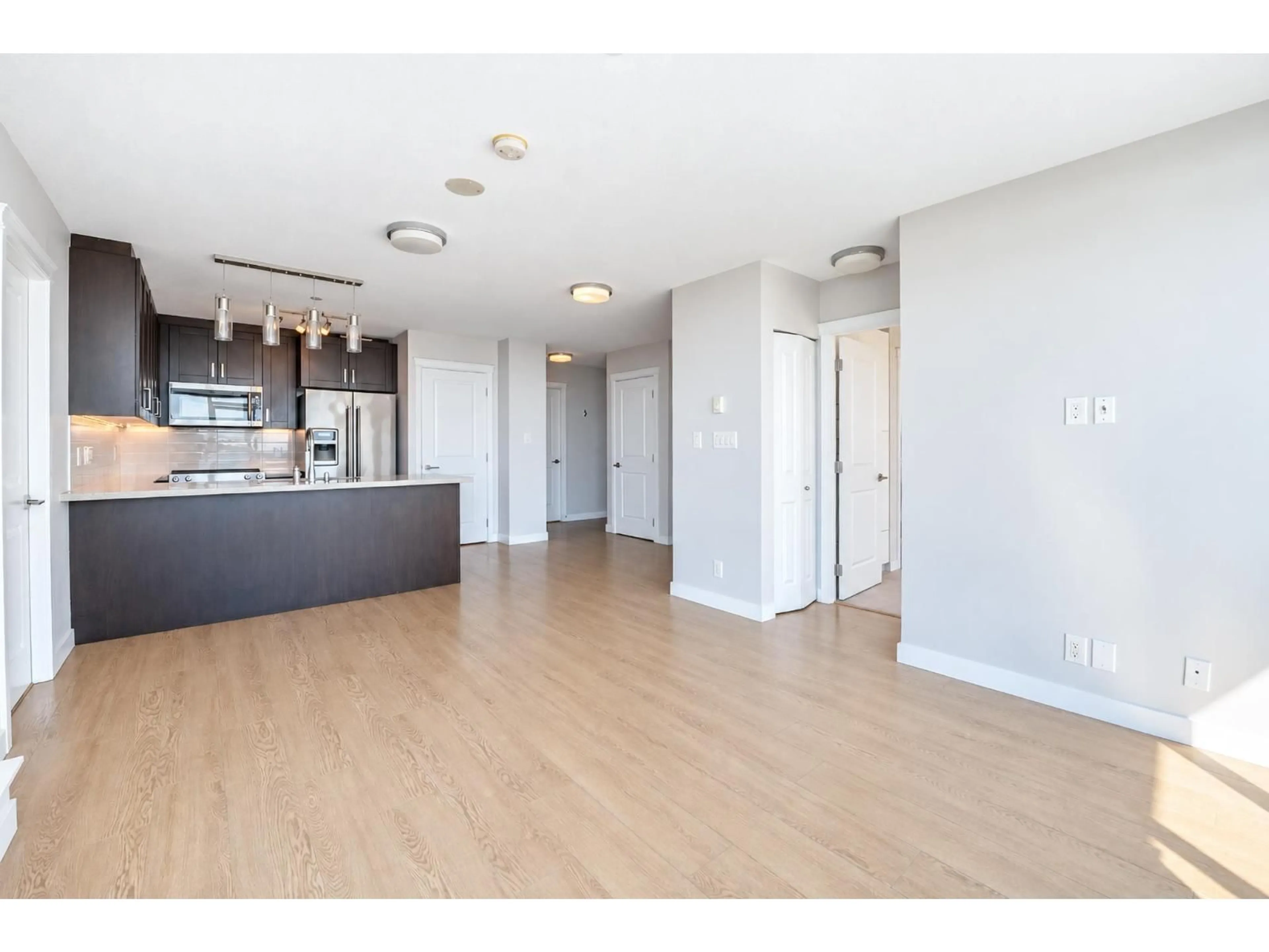 Open concept kitchen, wood/laminate floor for 3608 - 11967 80 AVENUE, Delta British Columbia V4C0E2