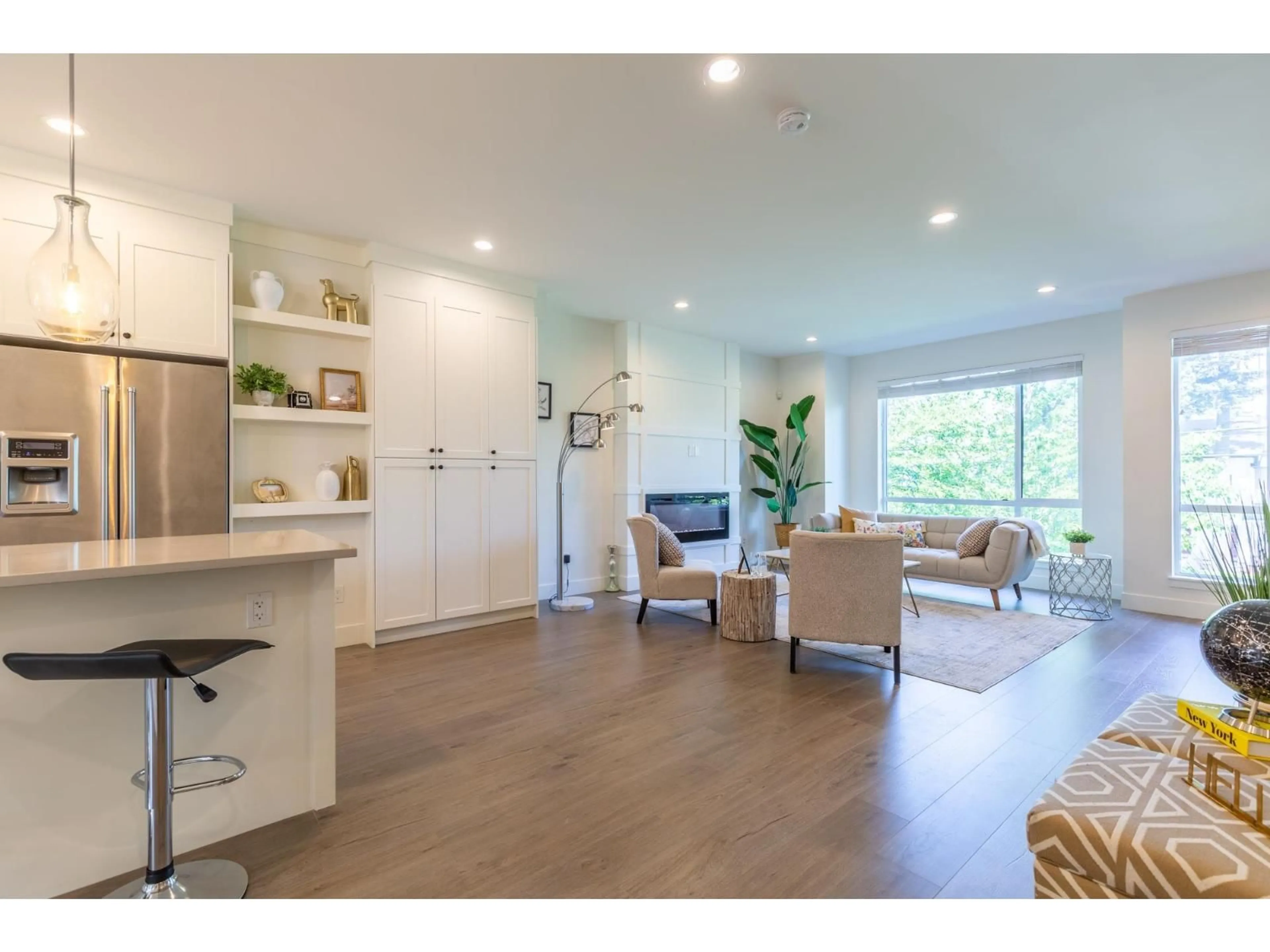 Living room with furniture, wood/laminate floor for 7 - 15688 28 AVENUE, Surrey British Columbia V3Z0N1