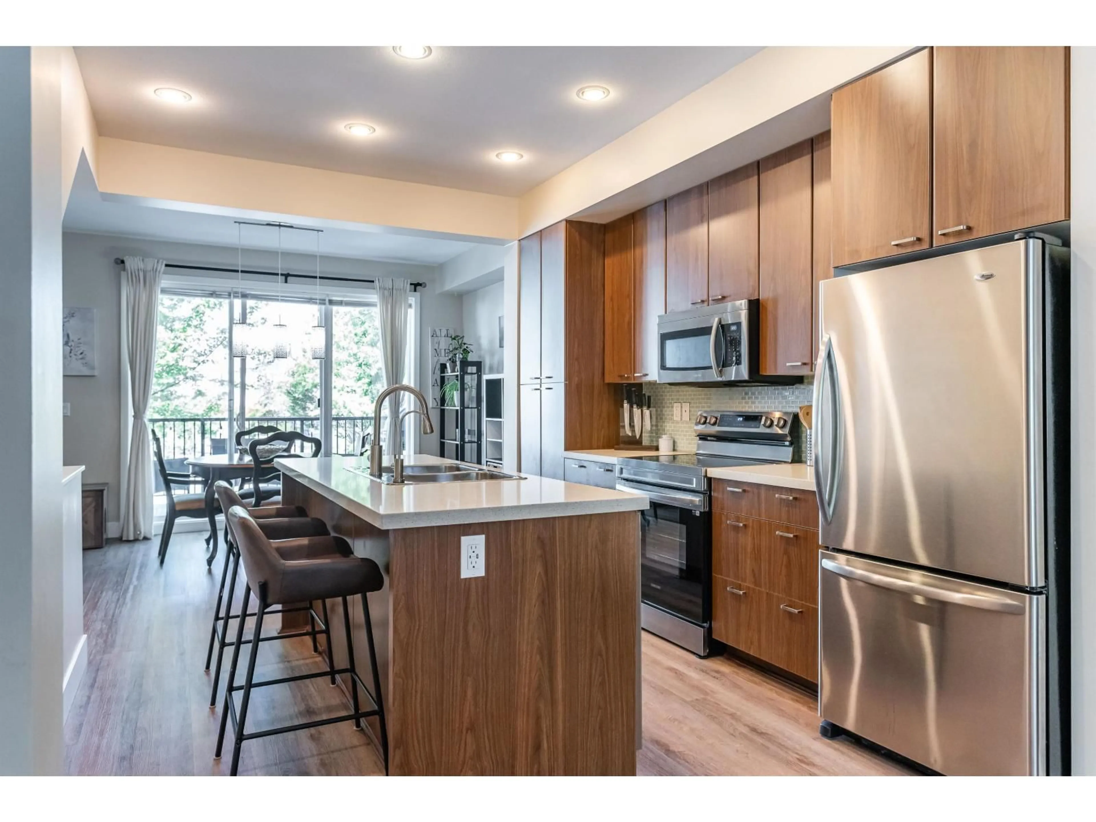 Open concept kitchen, wood/laminate floor for 46 - 2450 161A STREET, Surrey British Columbia V3Z8K4