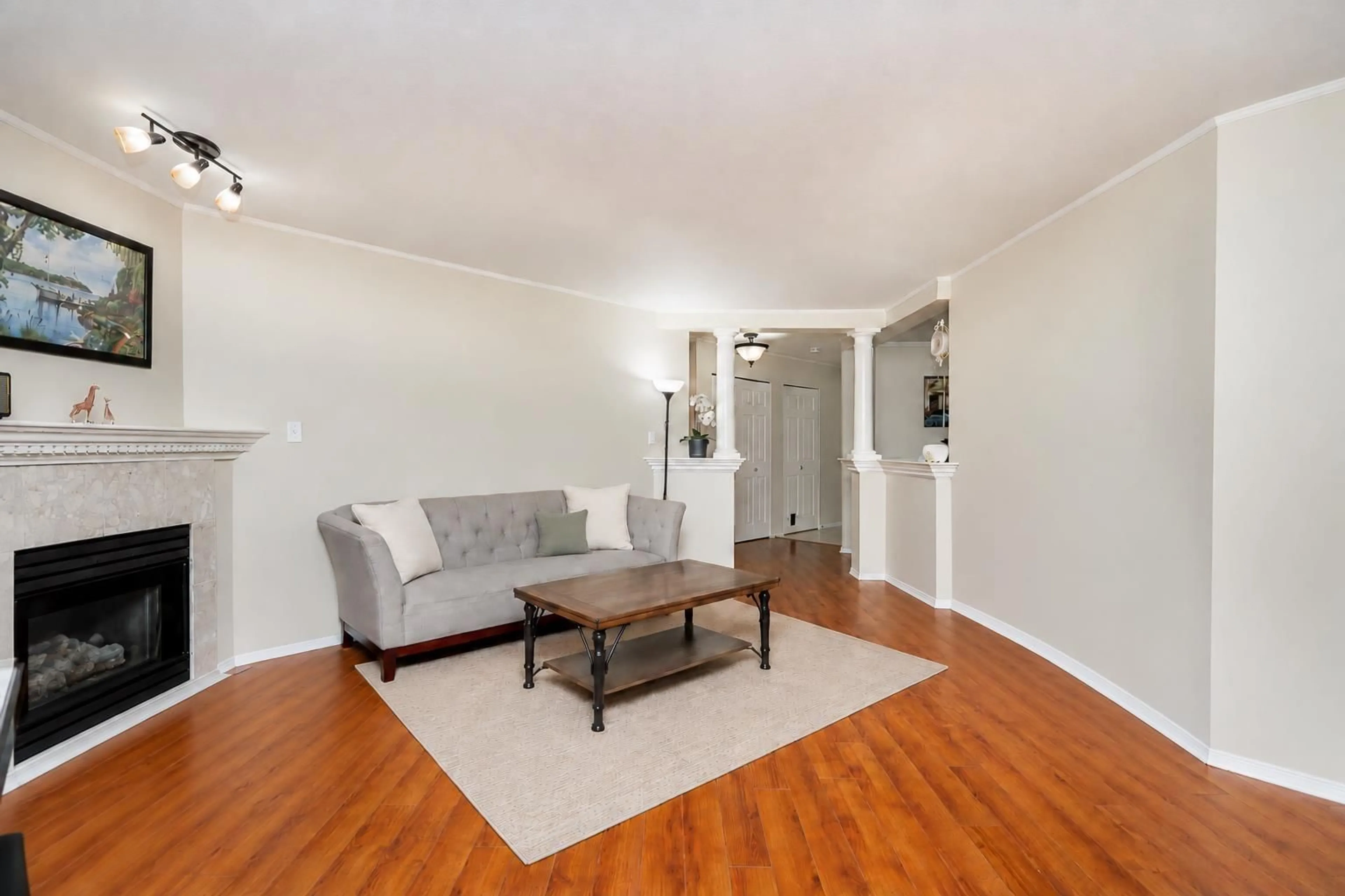 Living room with furniture, wood/laminate floor for 305 - 16065 83 AVENUE, Surrey British Columbia V4N0N2