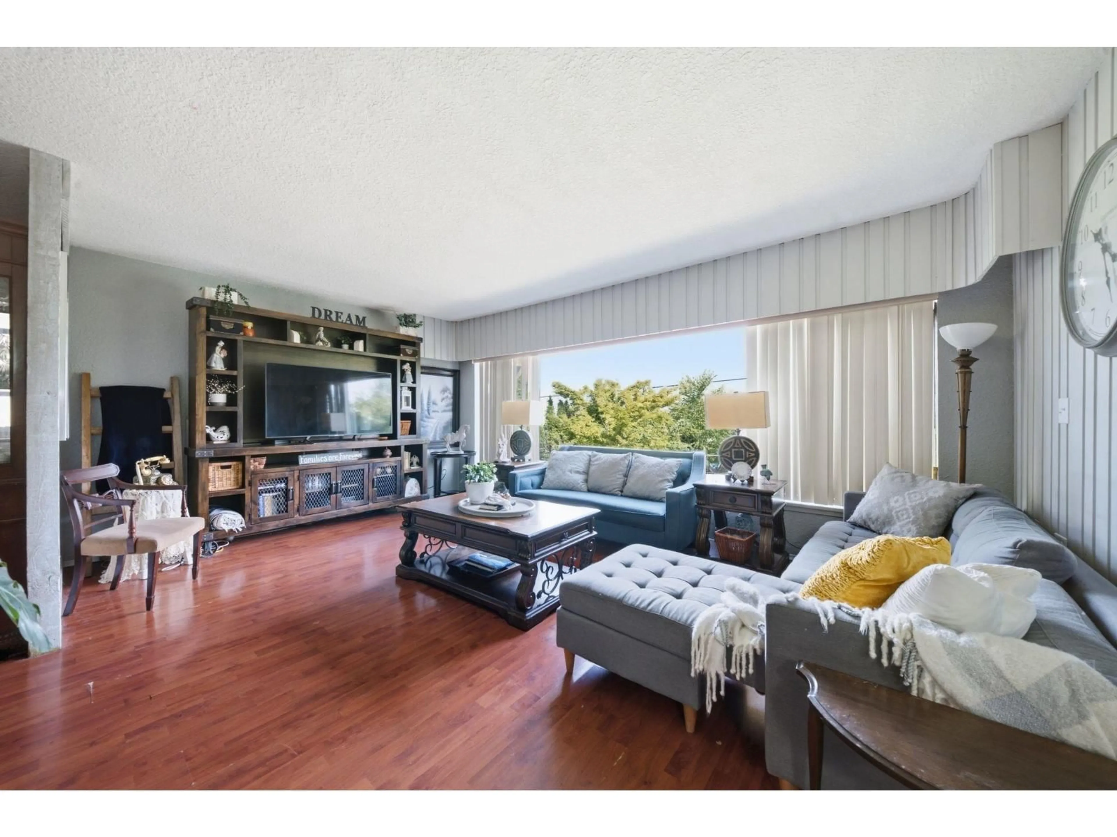 Living room with furniture, wood/laminate floor for 12222 100 AVENUE, Surrey British Columbia V3V2X1