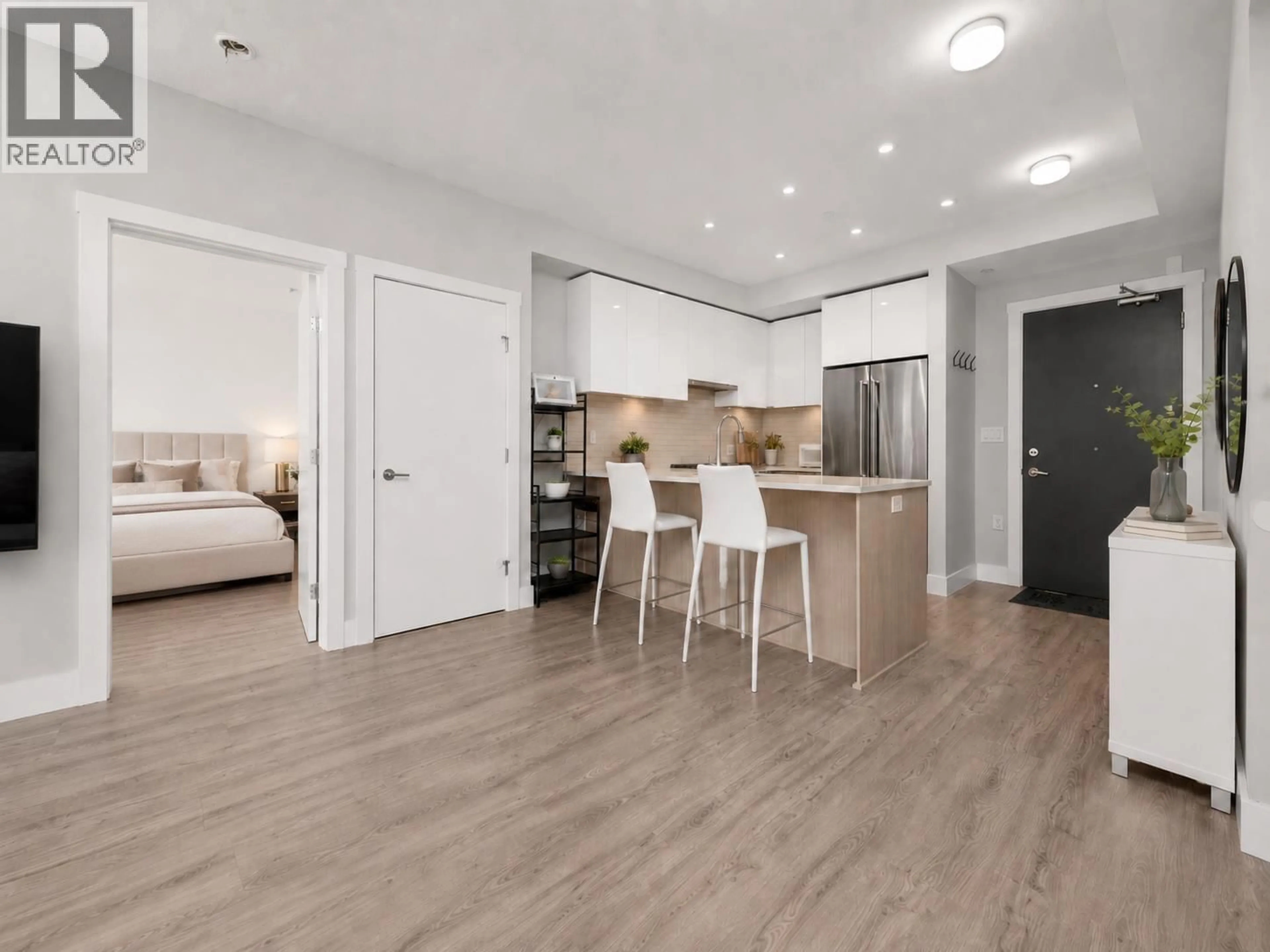 Open concept kitchen, wood/laminate floor for 309 - 3588 SAWMILL CRESCENT, Vancouver British Columbia V5S0H5