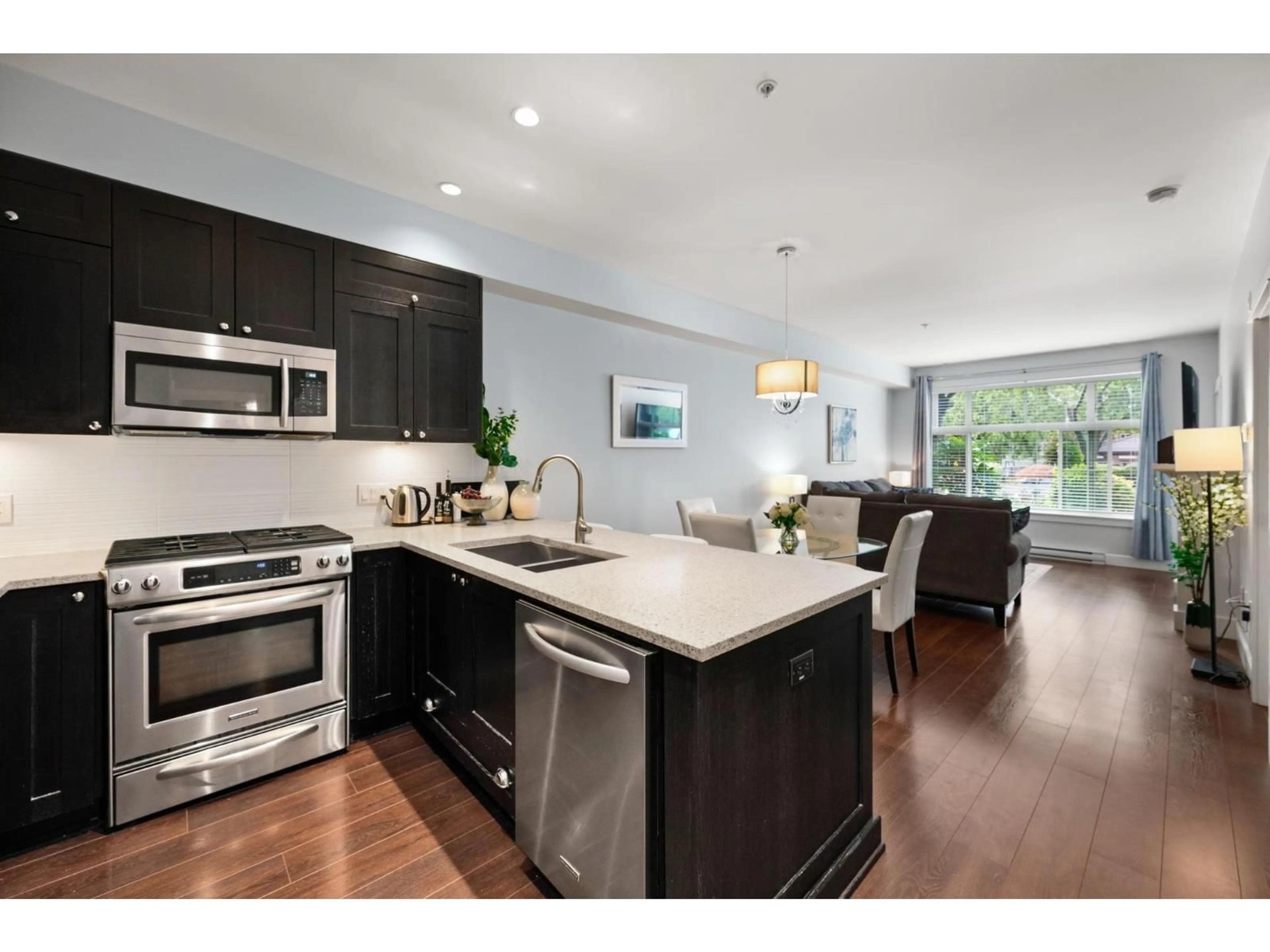 Open concept kitchen, wood/laminate floor for 117 - 15185 36 AVENUE, Surrey British Columbia V3Z4R3