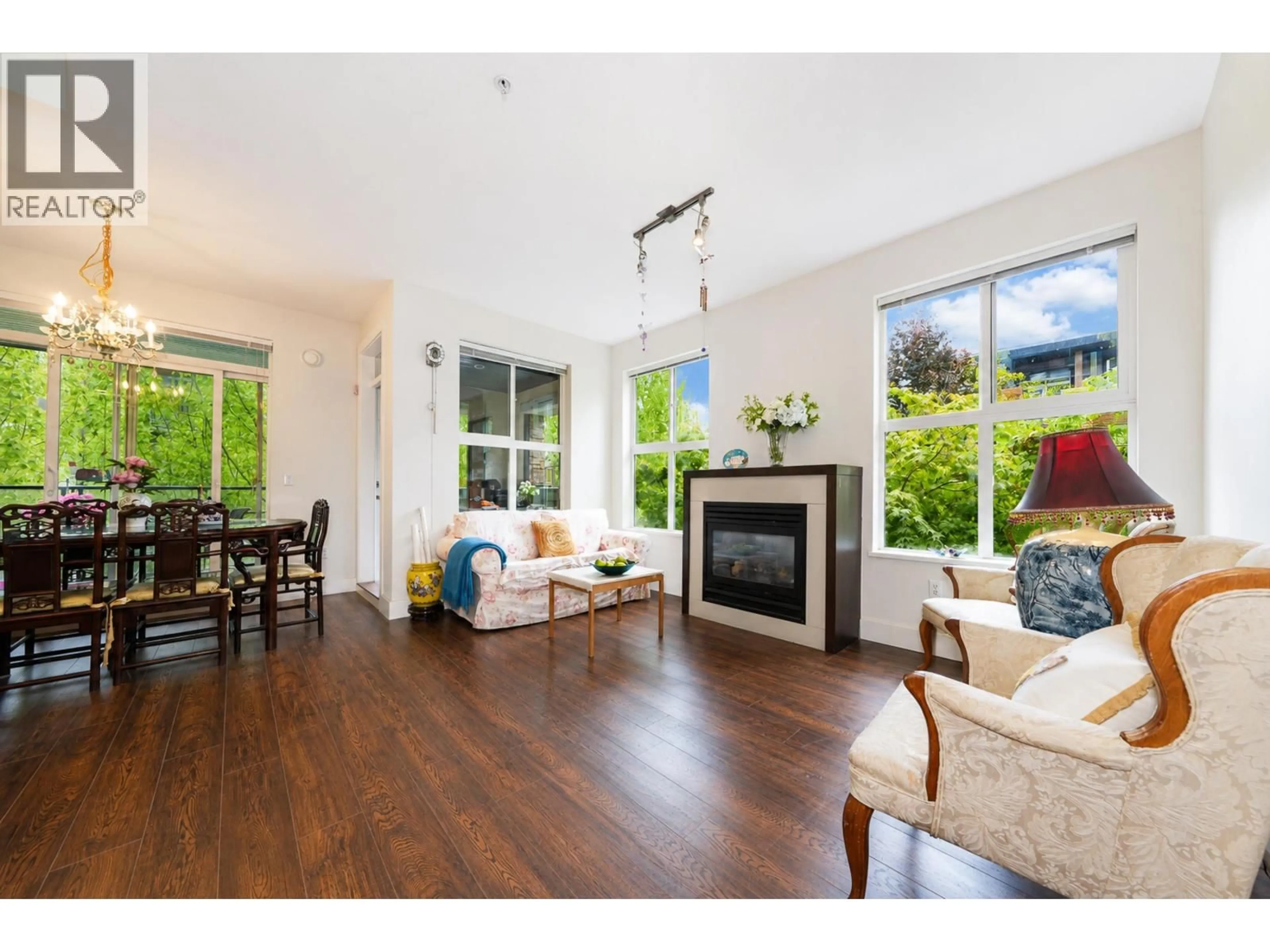 Living room with furniture, wood/laminate floor for 220 - 5928 BIRNEY AVENUE, Vancouver British Columbia V6S0B5