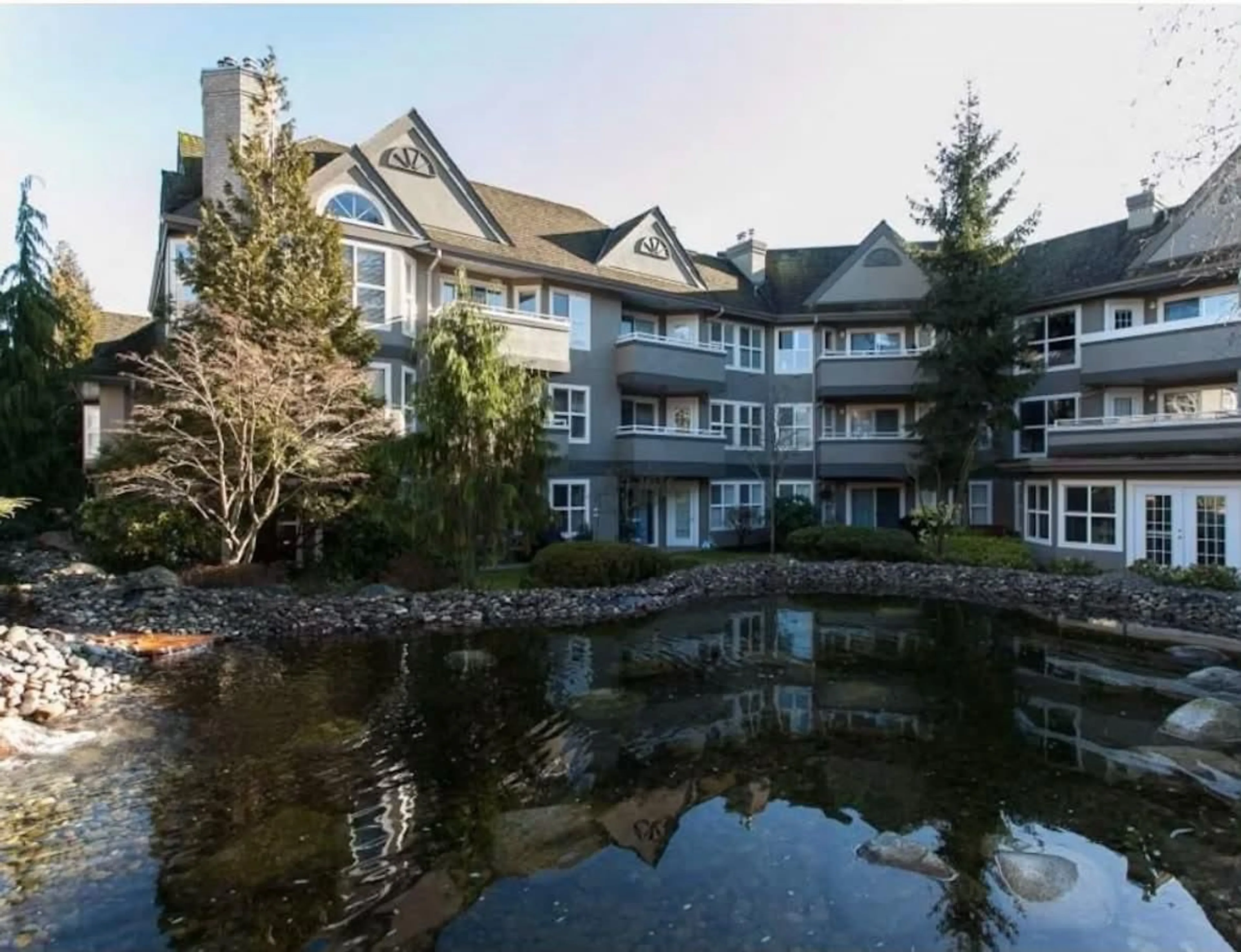 A pic from outside/outdoor area/front of a property/back of a property/a pic from drone, water/lake/river/ocean view for 205 - 6557 121 STREET, Surrey British Columbia V3W1E7