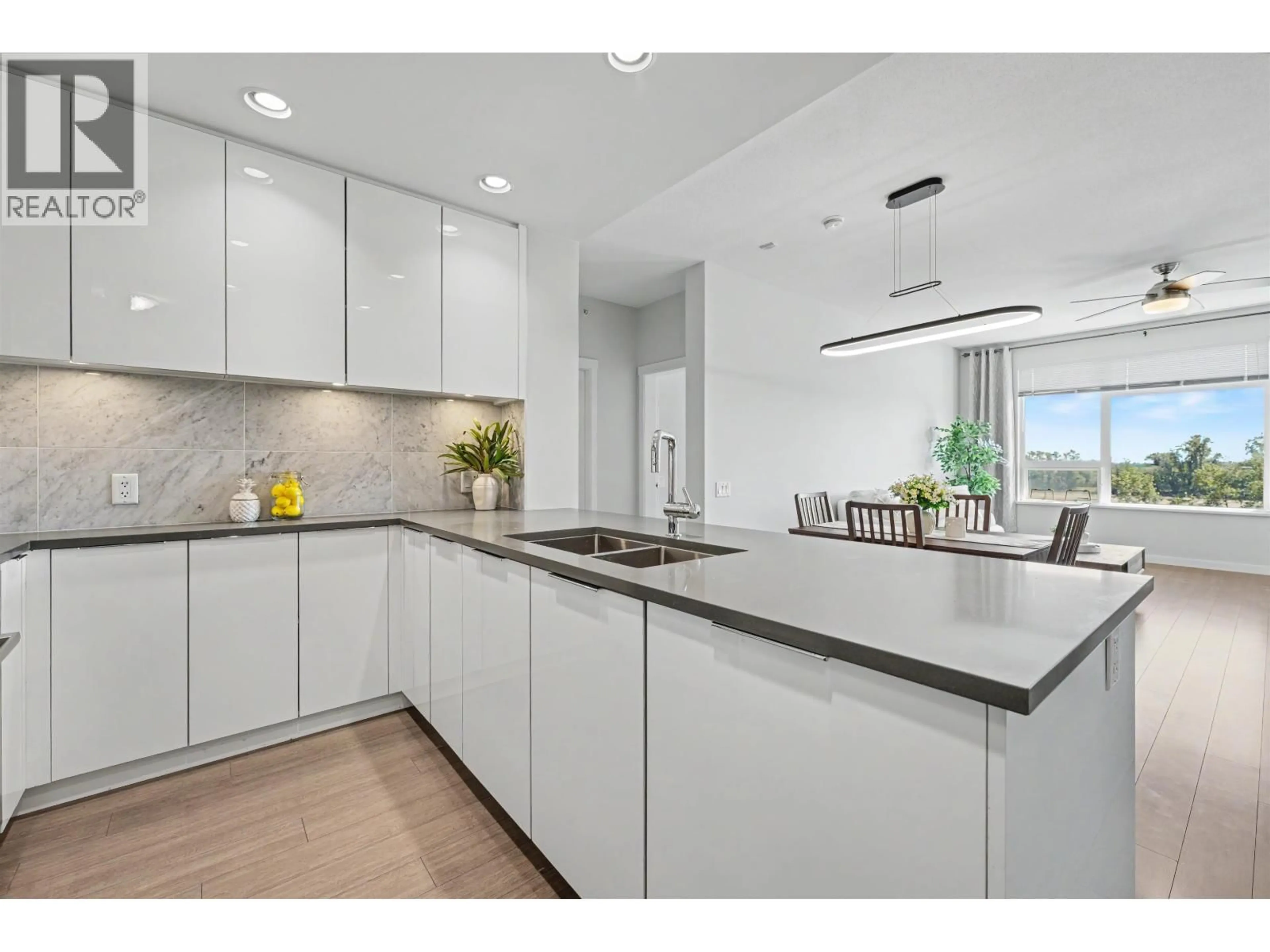 Open concept kitchen, ceramic/tile floor for 604 - 3289 RIVERWALK AVENUE, Vancouver British Columbia V5S0G2