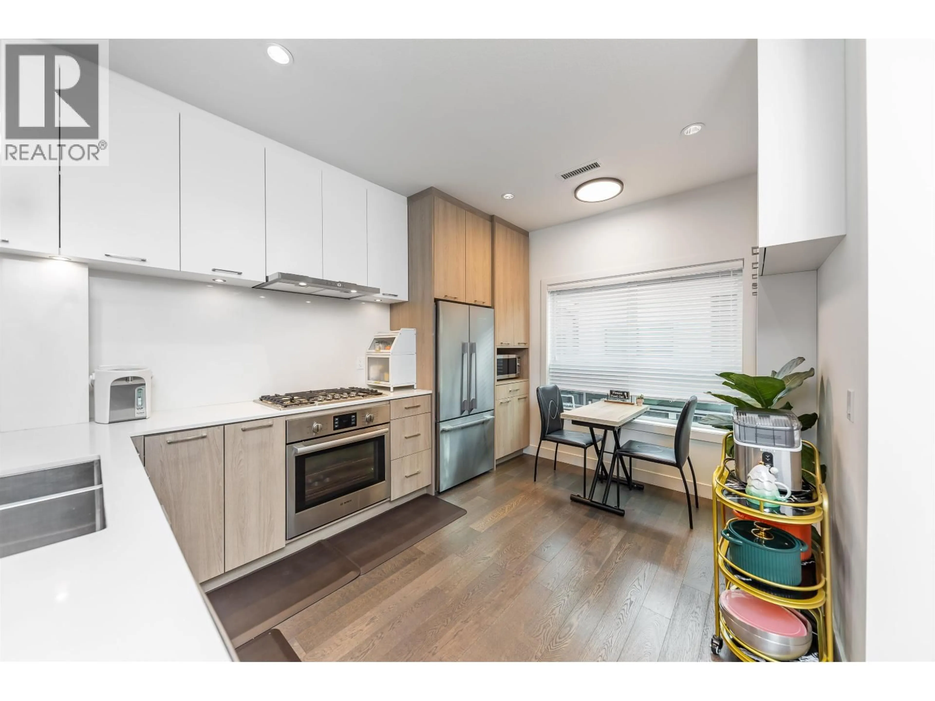 Open concept kitchen, wood/laminate floor for 21 - 7168 LYNNWOOD DRIVE, Richmond British Columbia V7C0E3