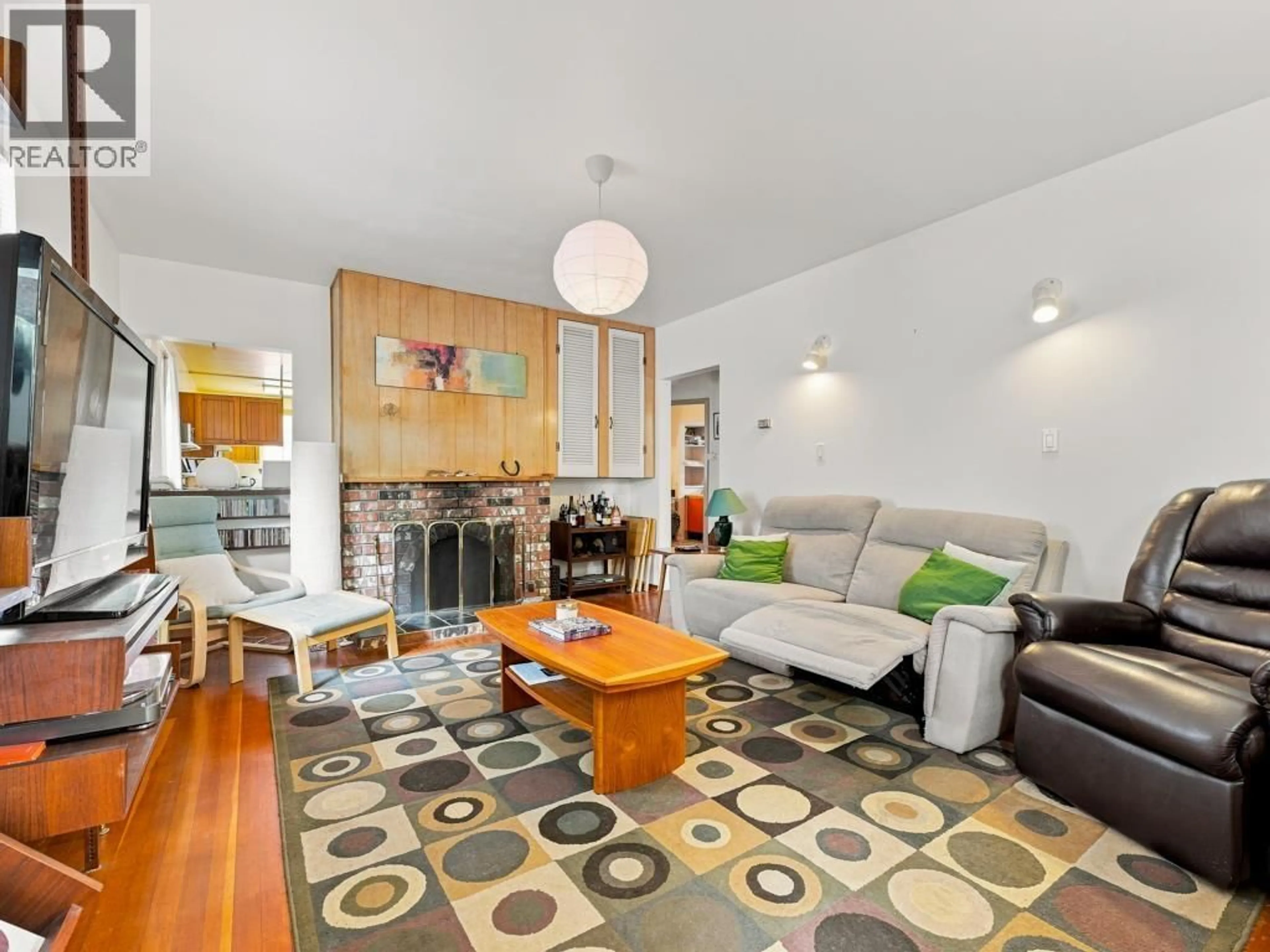 Living room with furniture, wood/laminate floor for 3017 17TH AVENUE, Vancouver British Columbia V5M2N5