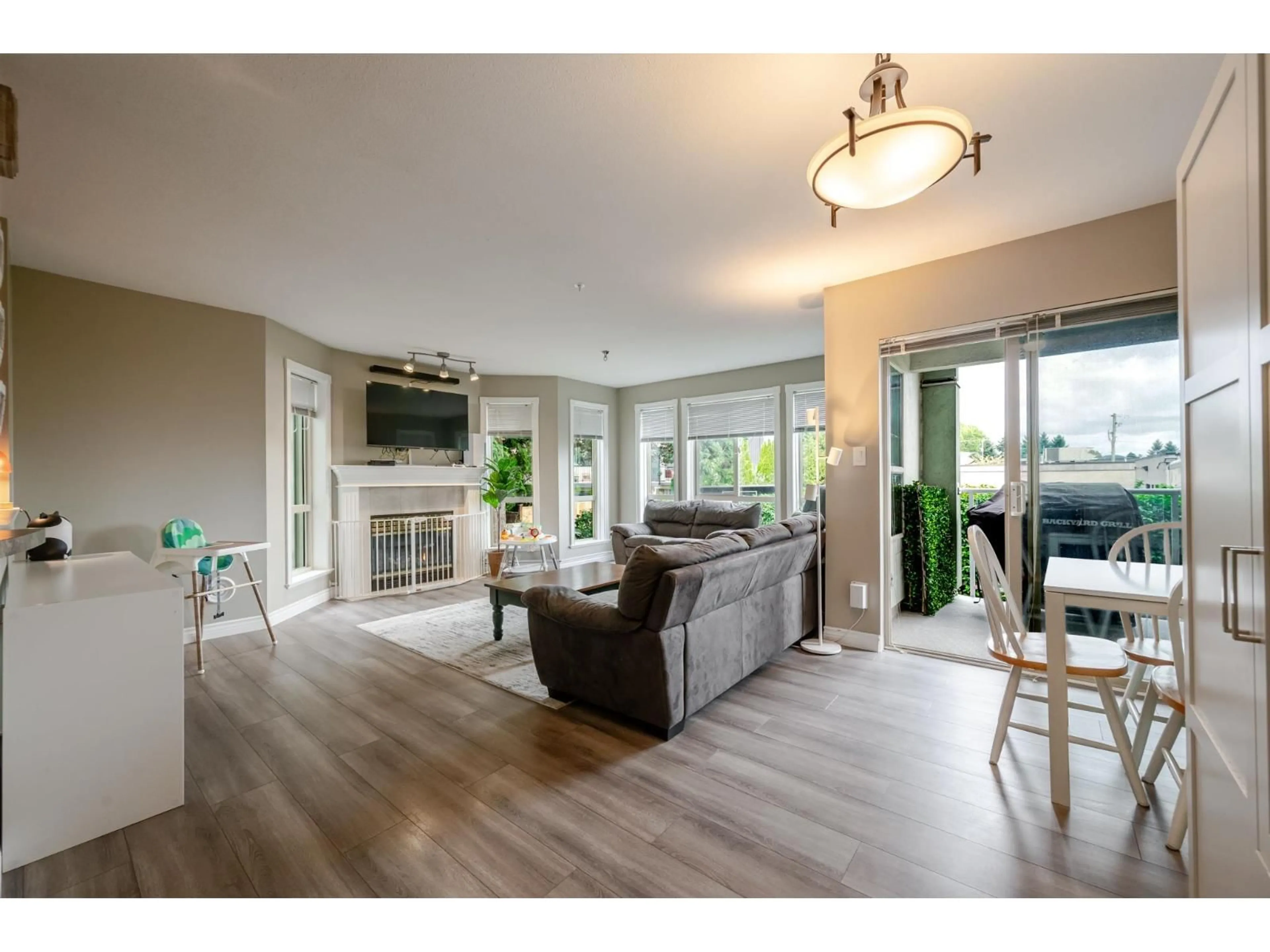 Living room with furniture, wood/laminate floor for 204 - 2585 WARE STREET, Abbotsford British Columbia V2S3E2
