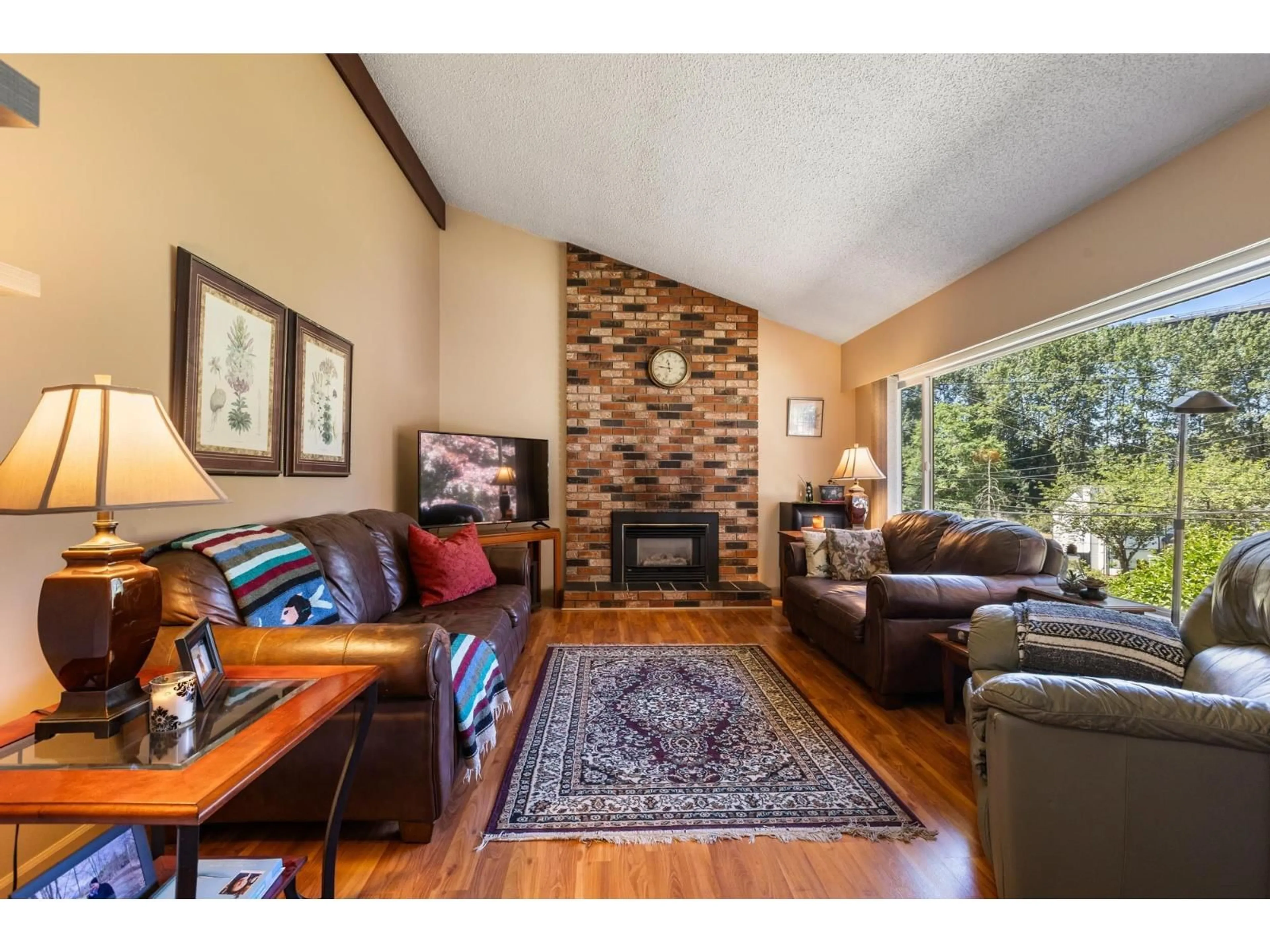 Living room with furniture, wood/laminate floor for 10264 MAIN STREET, Delta British Columbia V4C7H3