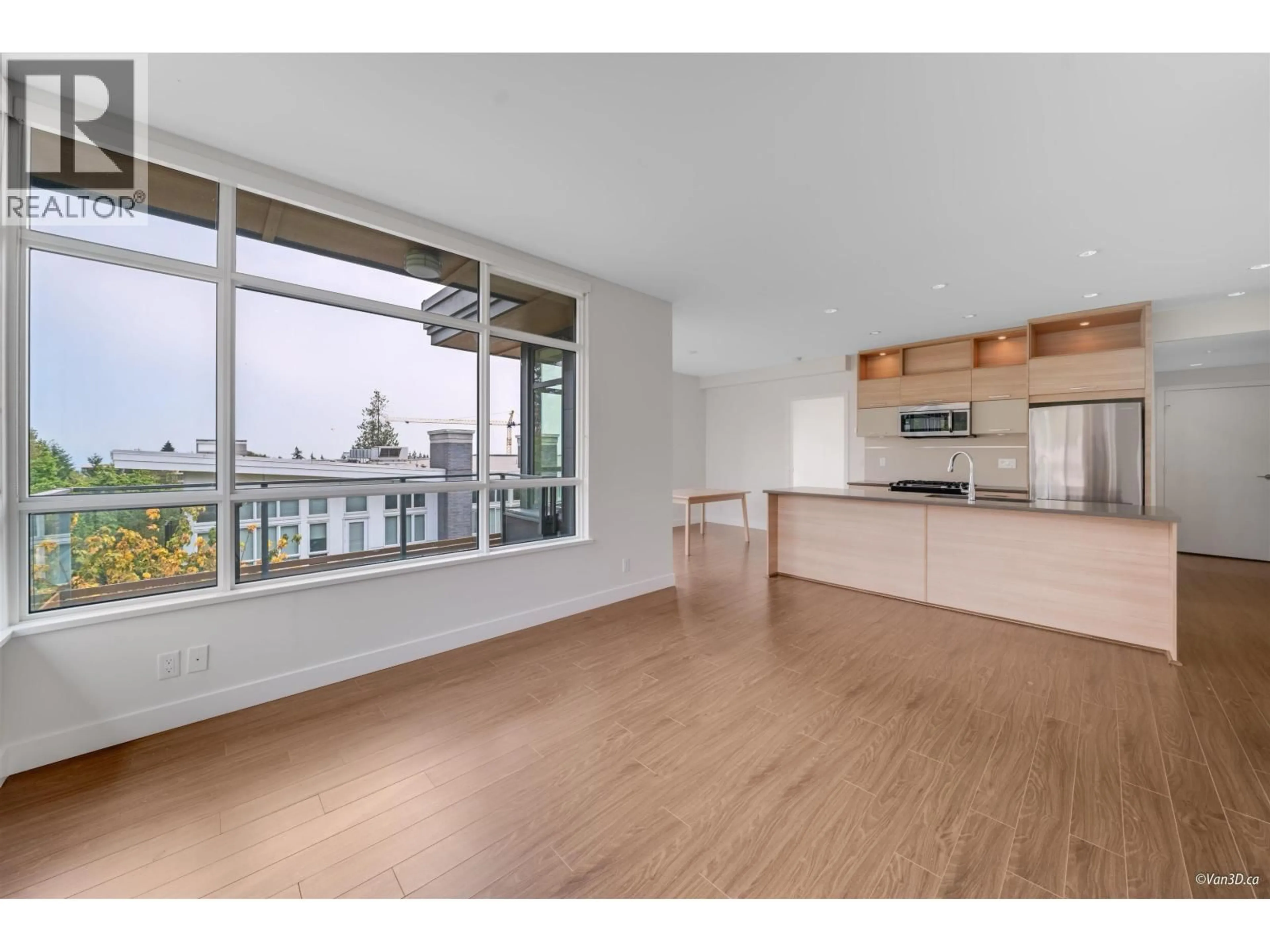 Open concept kitchen, wood/laminate floor for 412 - 9150 UNIVERSITY HIGH STREET, Burnaby British Columbia V5A0C5