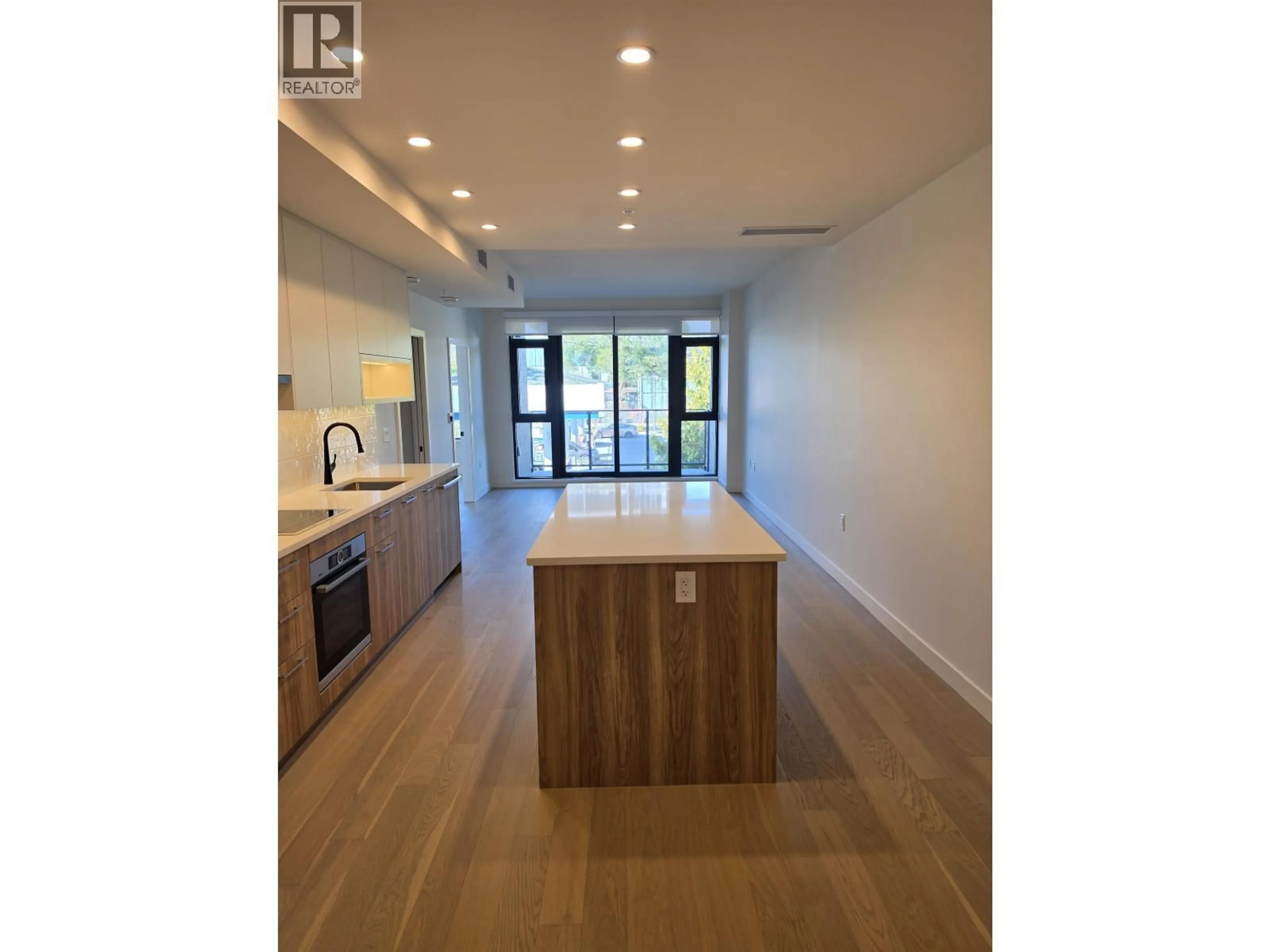 Open concept kitchen, wood/laminate floor for 310 - 8398 OAK STREET, Vancouver British Columbia V6P0L9