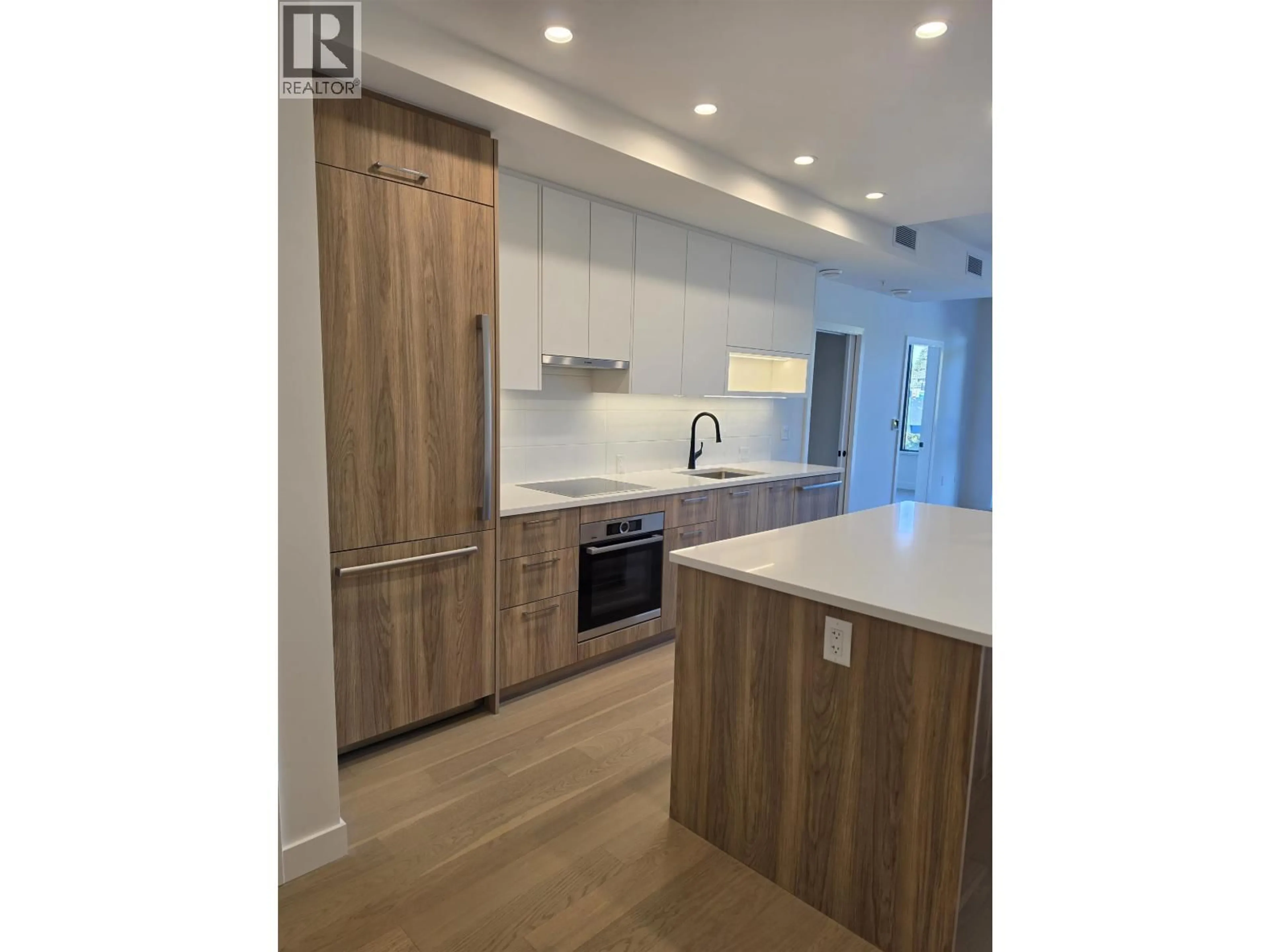 Open concept kitchen, wood/laminate floor for 310 - 8398 OAK STREET, Vancouver British Columbia V6P0L9