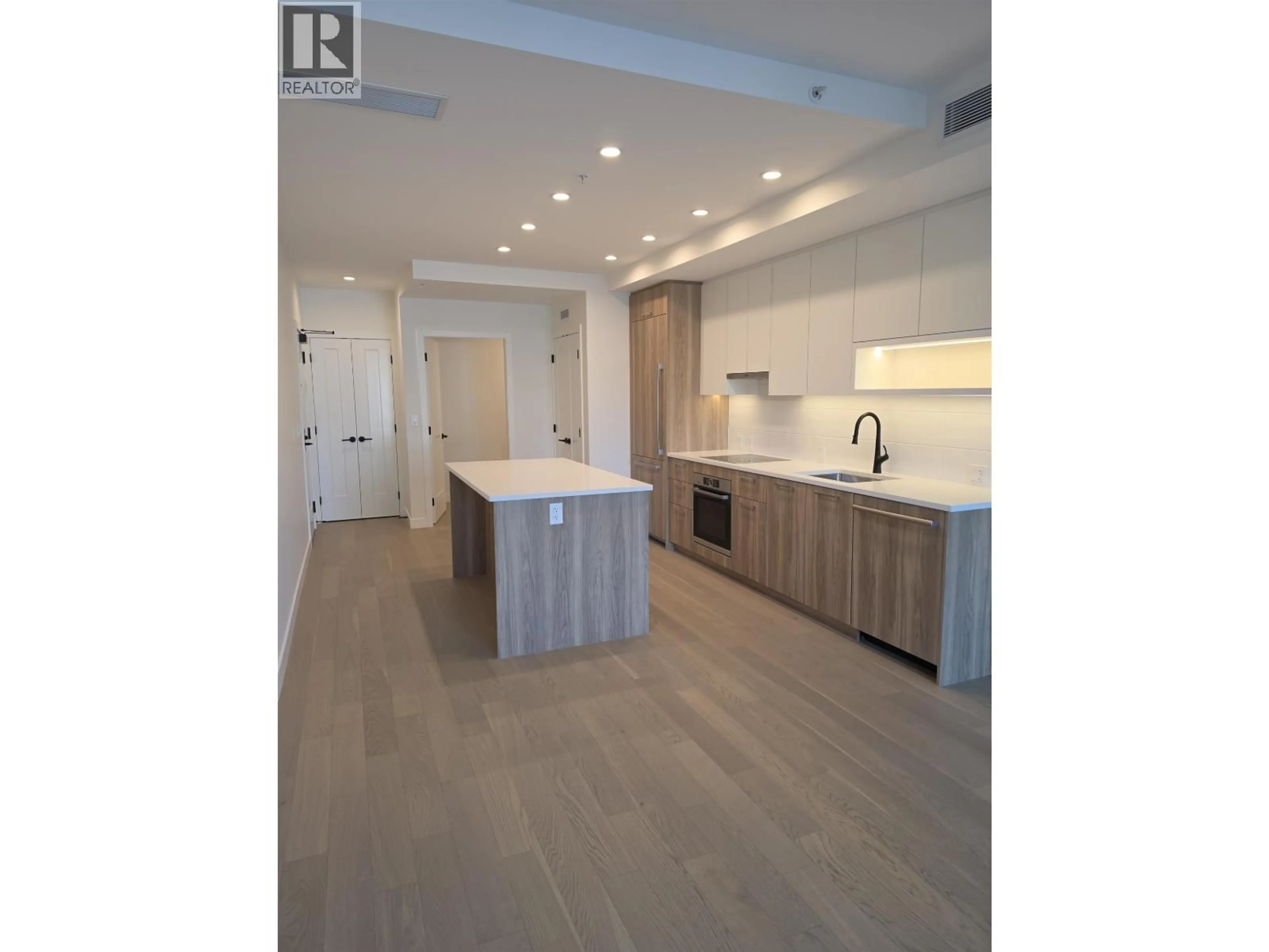 Open concept kitchen, wood/laminate floor for 310 - 8398 OAK STREET, Vancouver British Columbia V6P0L9
