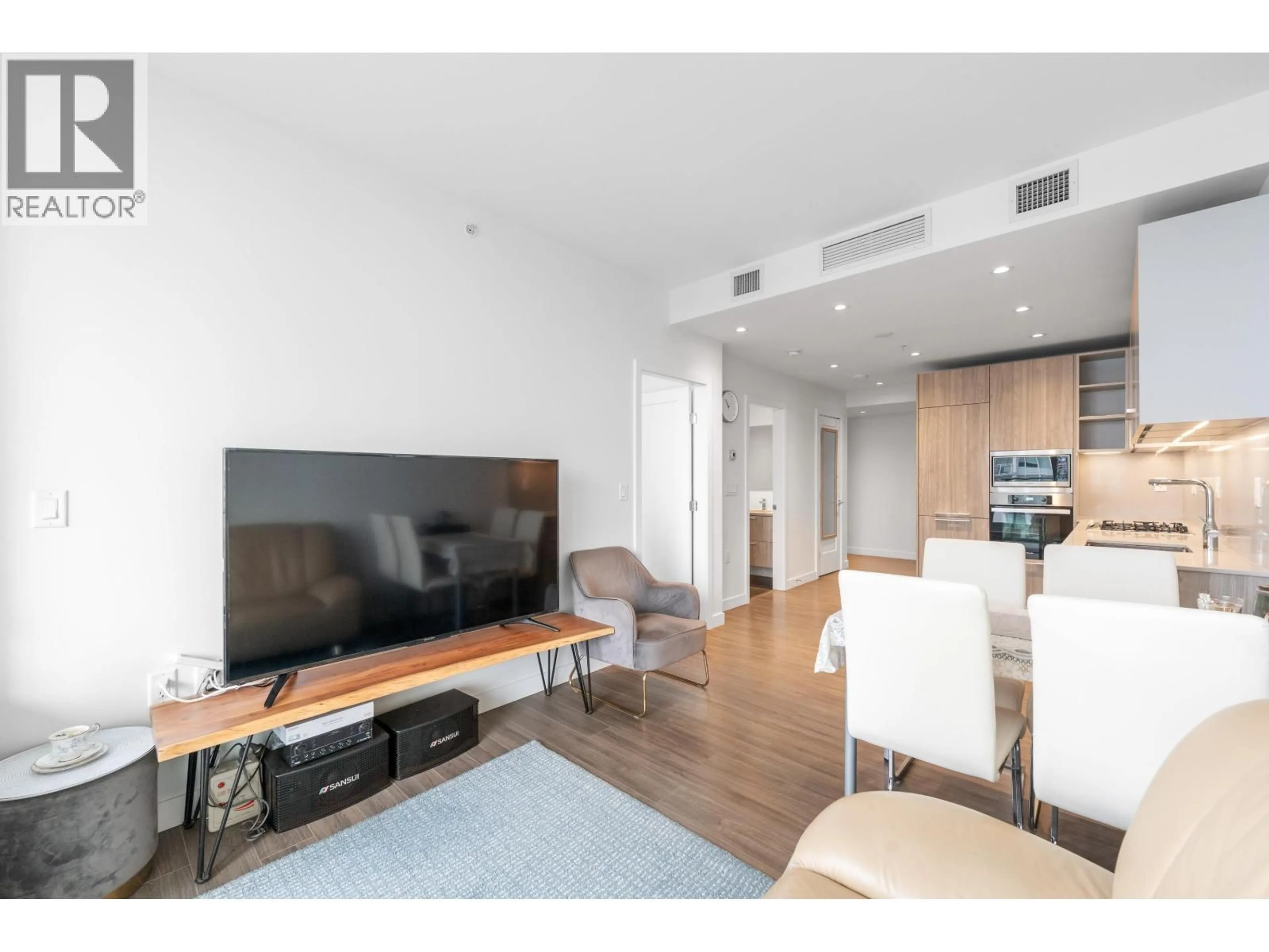 Living room with furniture, wood/laminate floor for 606 - 6699 DUNBLANE AVENUE, Burnaby British Columbia V5H0J8