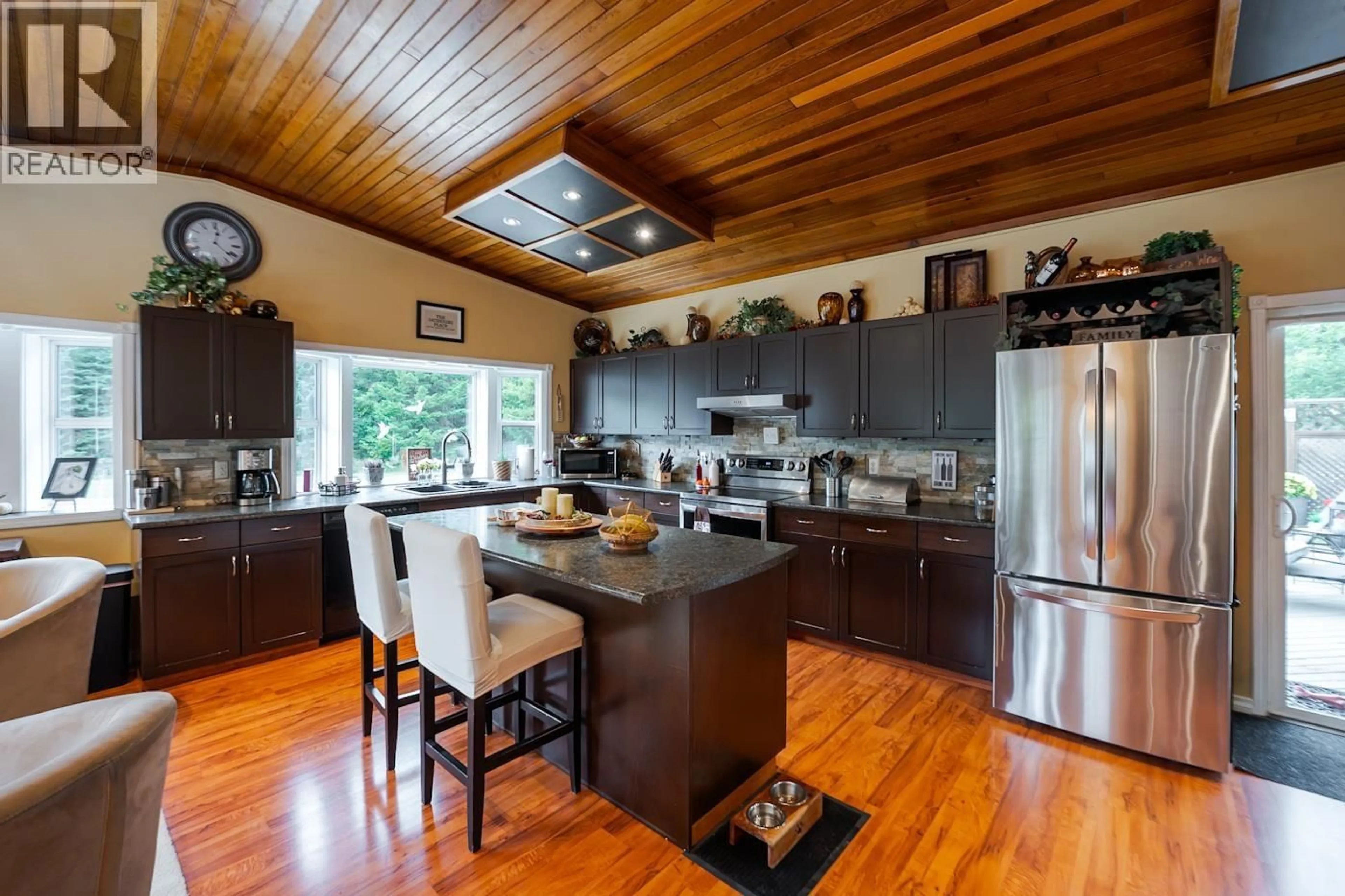 Open concept kitchen, wood/laminate floor for 6281 NORTH NECHAKO ROAD, Prince George British Columbia V2K4Z2