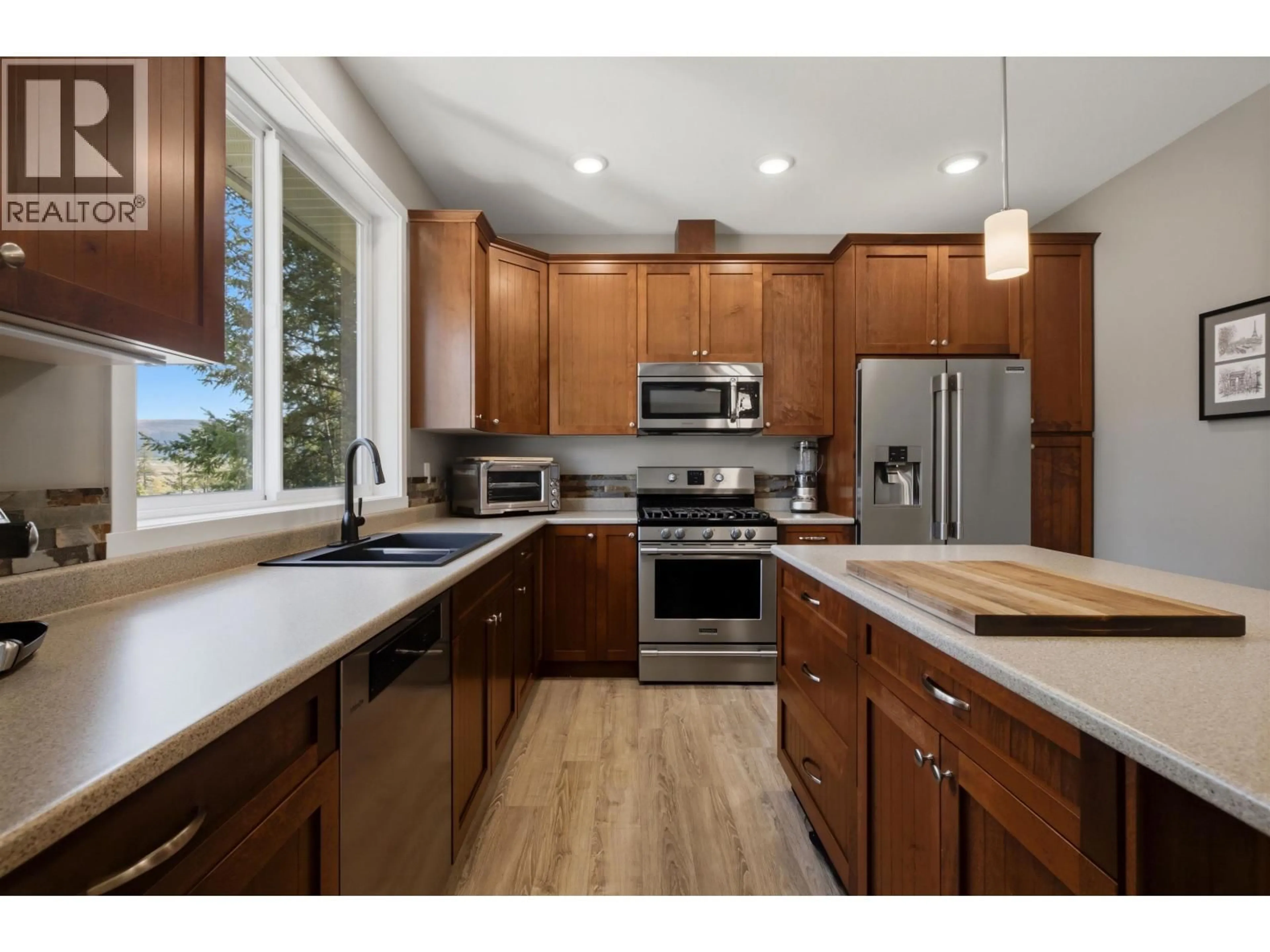 Open concept kitchen, wood/laminate floor for 2050 LAKESIDE DRIVE, Williams Lake British Columbia V2G5H4