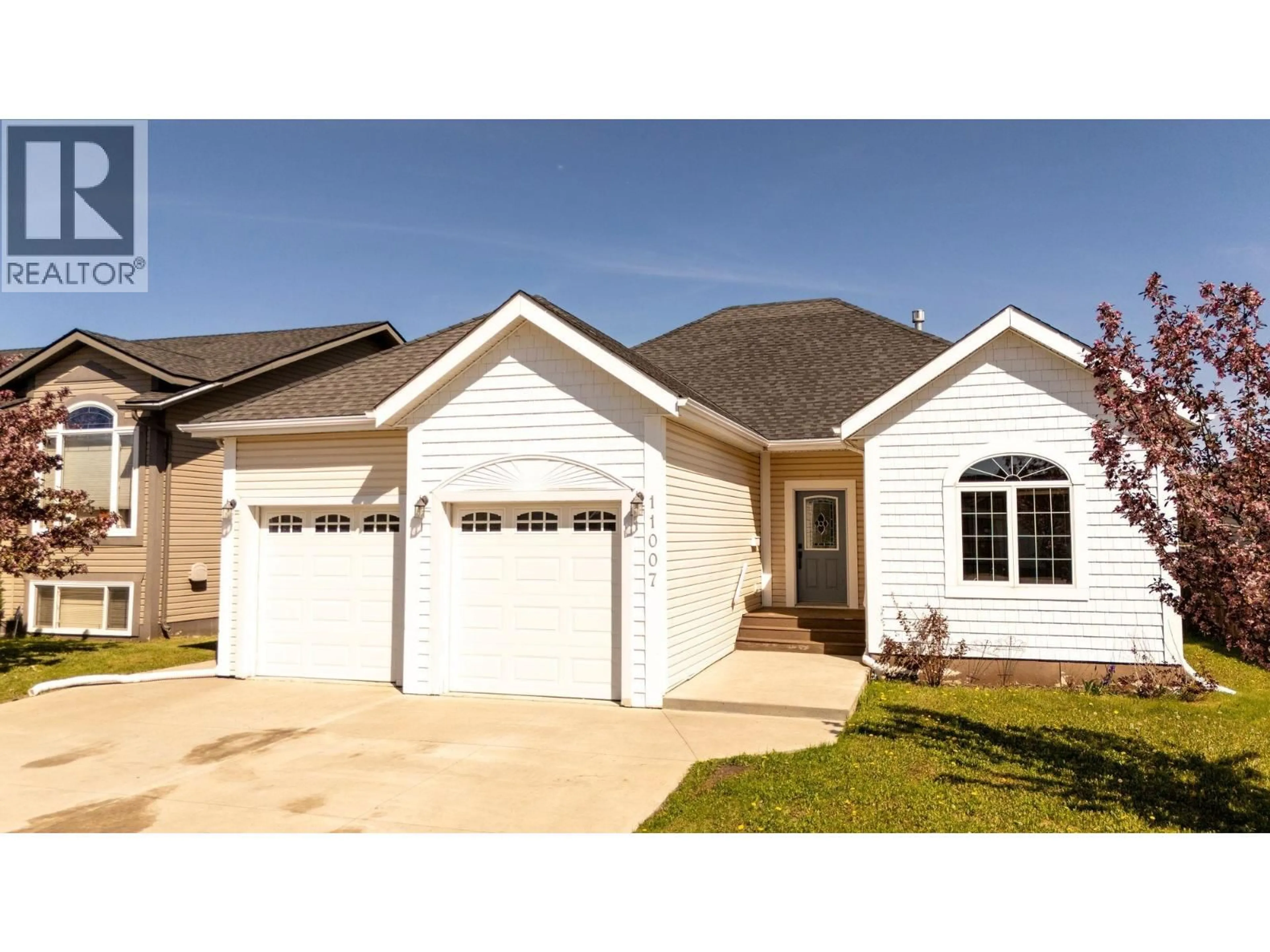 Home with vinyl exterior material, street for 11007 88A STREET, Fort St. John British Columbia V1J7G2