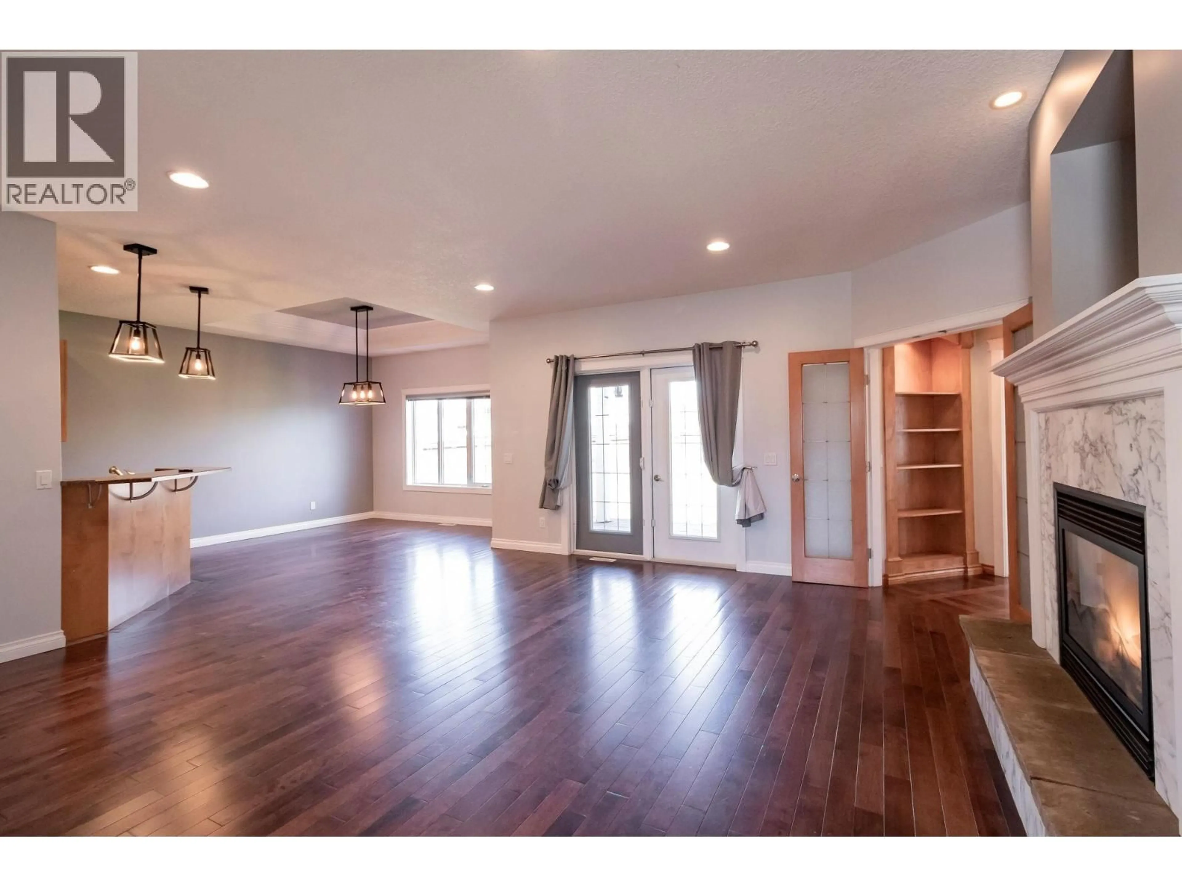 Open concept kitchen, wood/laminate floor for 11007 88A STREET, Fort St. John British Columbia V1J7G2