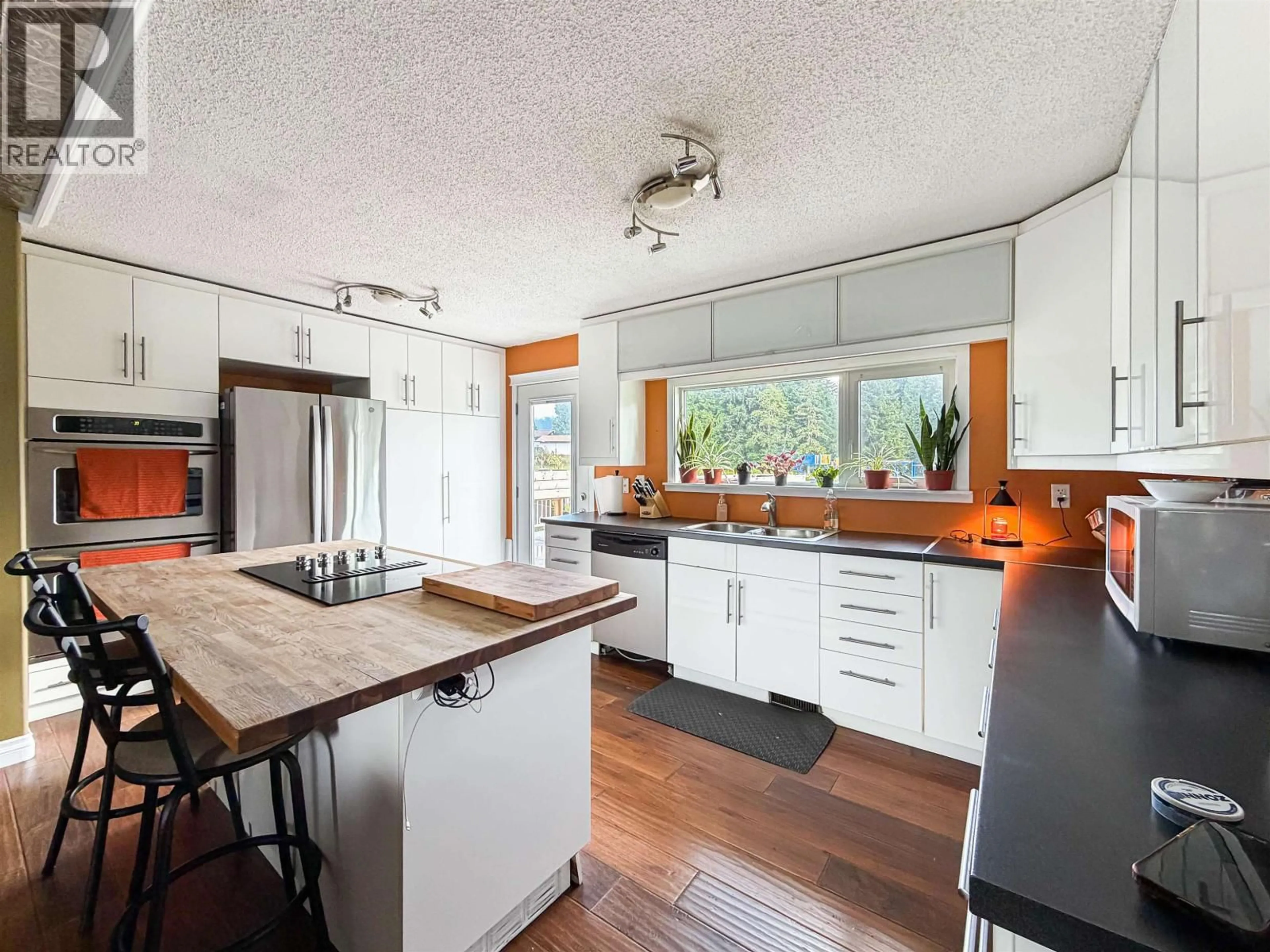 Open concept kitchen, wood/laminate floor for 56 DAVY CRESCENT, Kitimat British Columbia V8C1C5